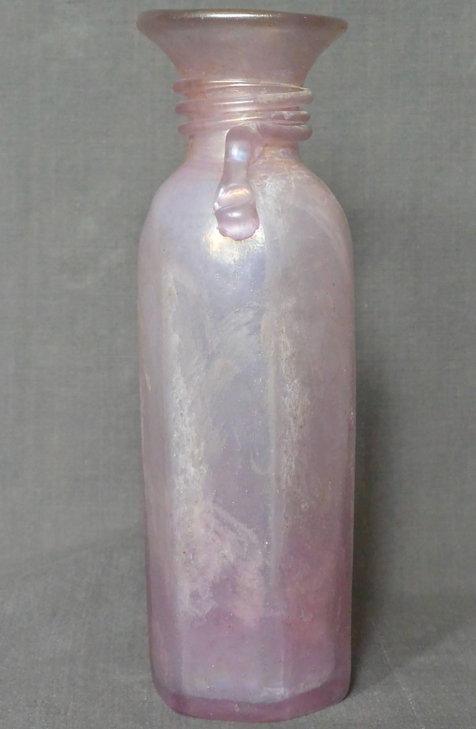 Seguso Scavo Murano amethyst vase. Purple / amethyst bud vase with handle, Venice, Italy, circa 1940.
Dimensions: 8.75” height x 2.38