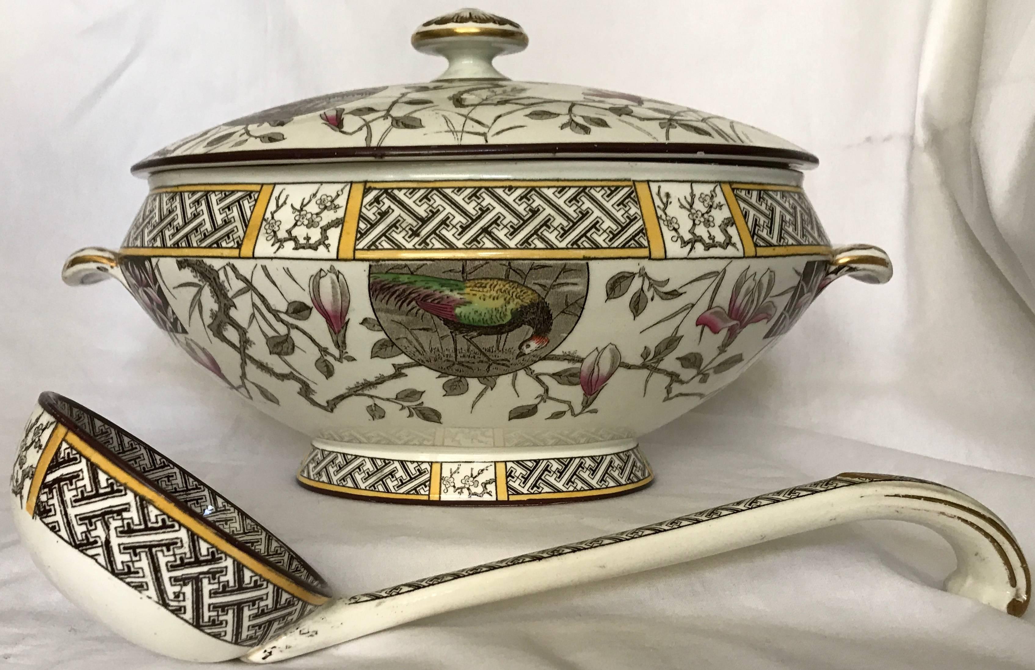 Aesthetic Movement soup tureen with ladle. Aesthetic Movement soup tureen with ladle and cover in brown, yellow and green Faisan pattern with tulip and cherry blossom branches. Markings for Minton 