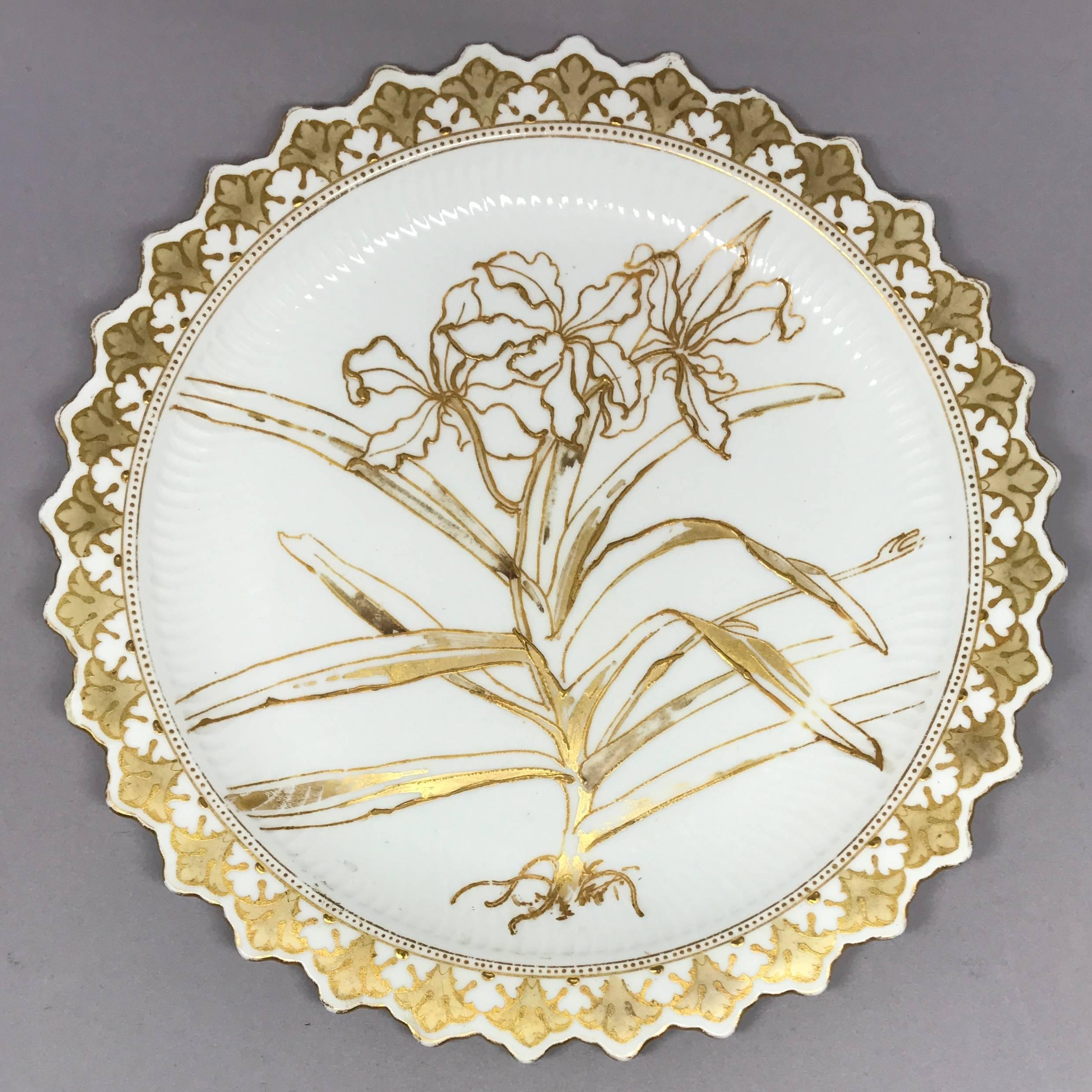 Set of six Aesthetic Movement gilt painted orchid plates. Six uniquely painted plates with shaped arabesque banded border, fluted dishing centering a unique orchid variety on each plate. Markings for Doulton Burslem, England, circa 1880.