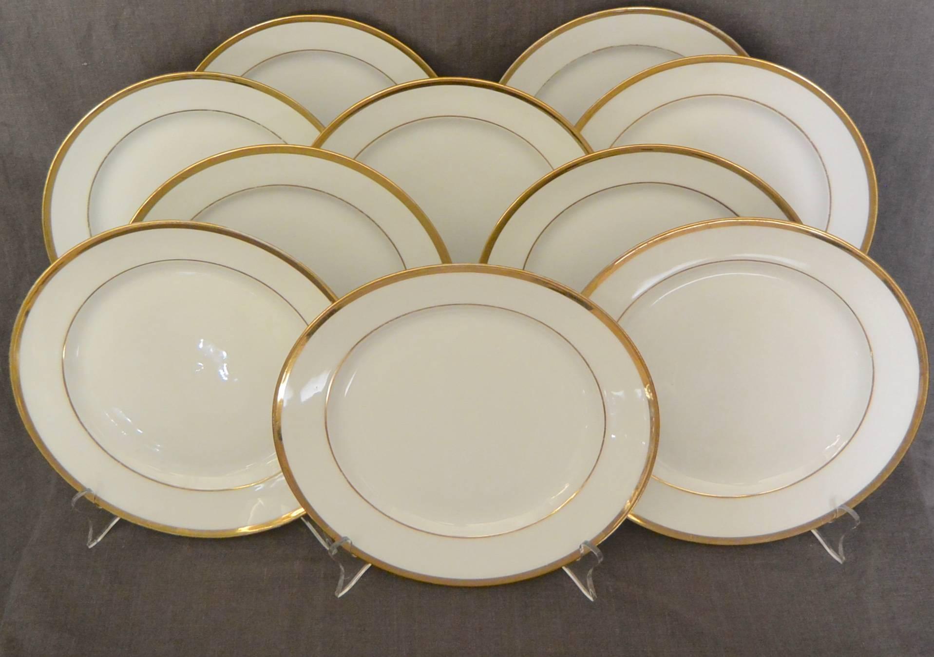 Set of ten white and gilt French Empire plates.  Set of ten Empire white and gilt plates with under-glaze red markings for L. Ernie 61 Rue du Bac., France, early 1800. 
Diameter: 9.25