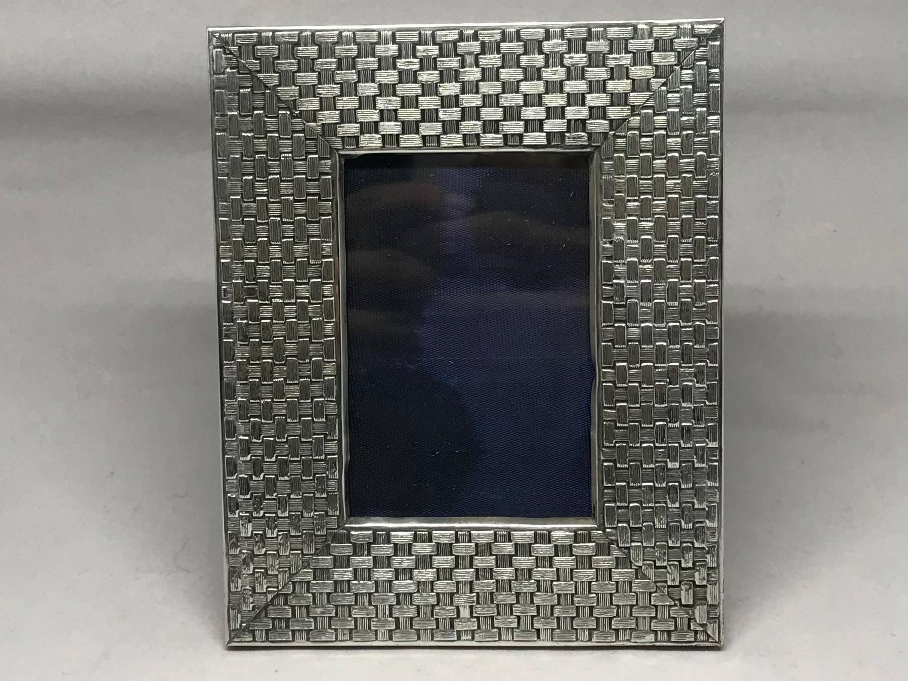 MIdcentury Italian sterling silver frame.  Rectangular woven basket pattern silver picture frame with lacquered wood easel back for horizontal or vertical display.  Stamp marks for Italian sterling; in excellent vintage condition.  Italy, circa