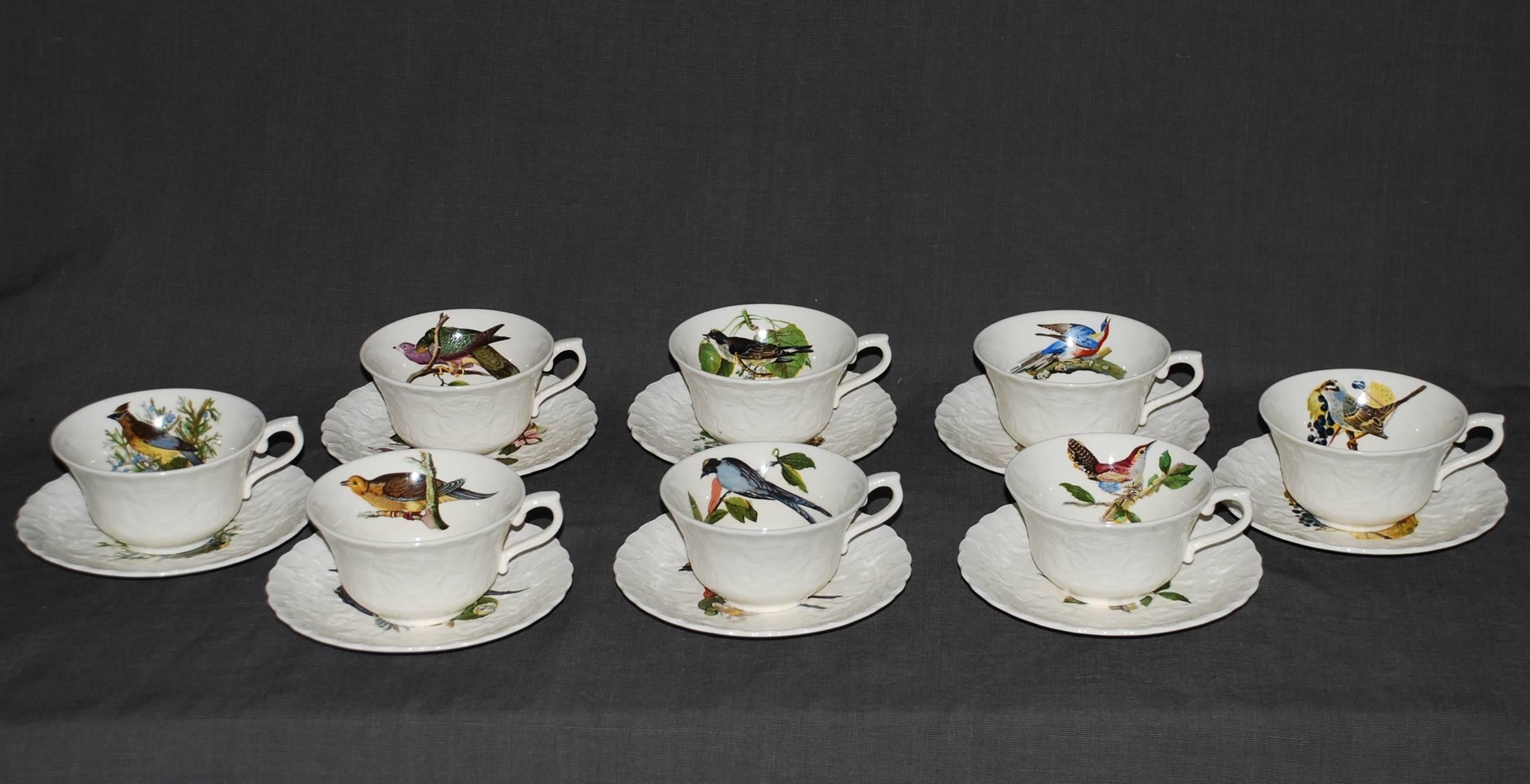 Set of eight audubon birds of America tea/coffee cups and saucers in cream with raised floral border centering on eight different birds. Alfred Meakin, England, circa 1940.
1-cedar bird #43
1-band tailed pigeon #62
1-white crowned sparrow