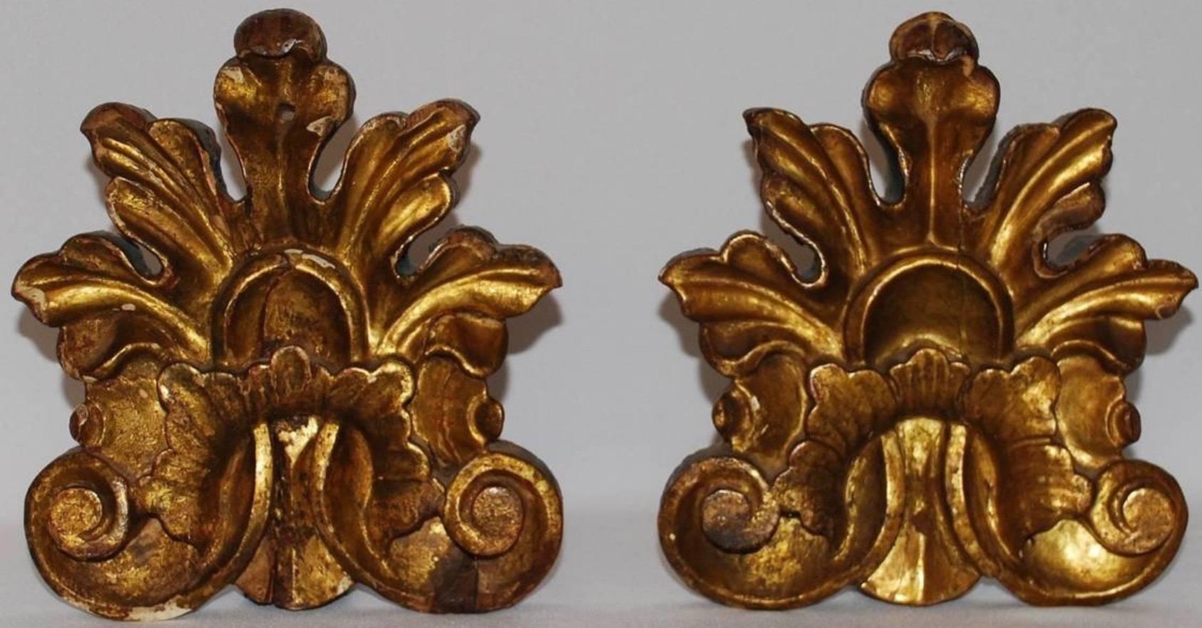 Pair 18th century Italian giltwood neoclassical ornaments.  Gilt carved anthemion architectural elements for display or as bookends.  Italy, late 18th century.
Dimensions: 9" H x 7.75" W

