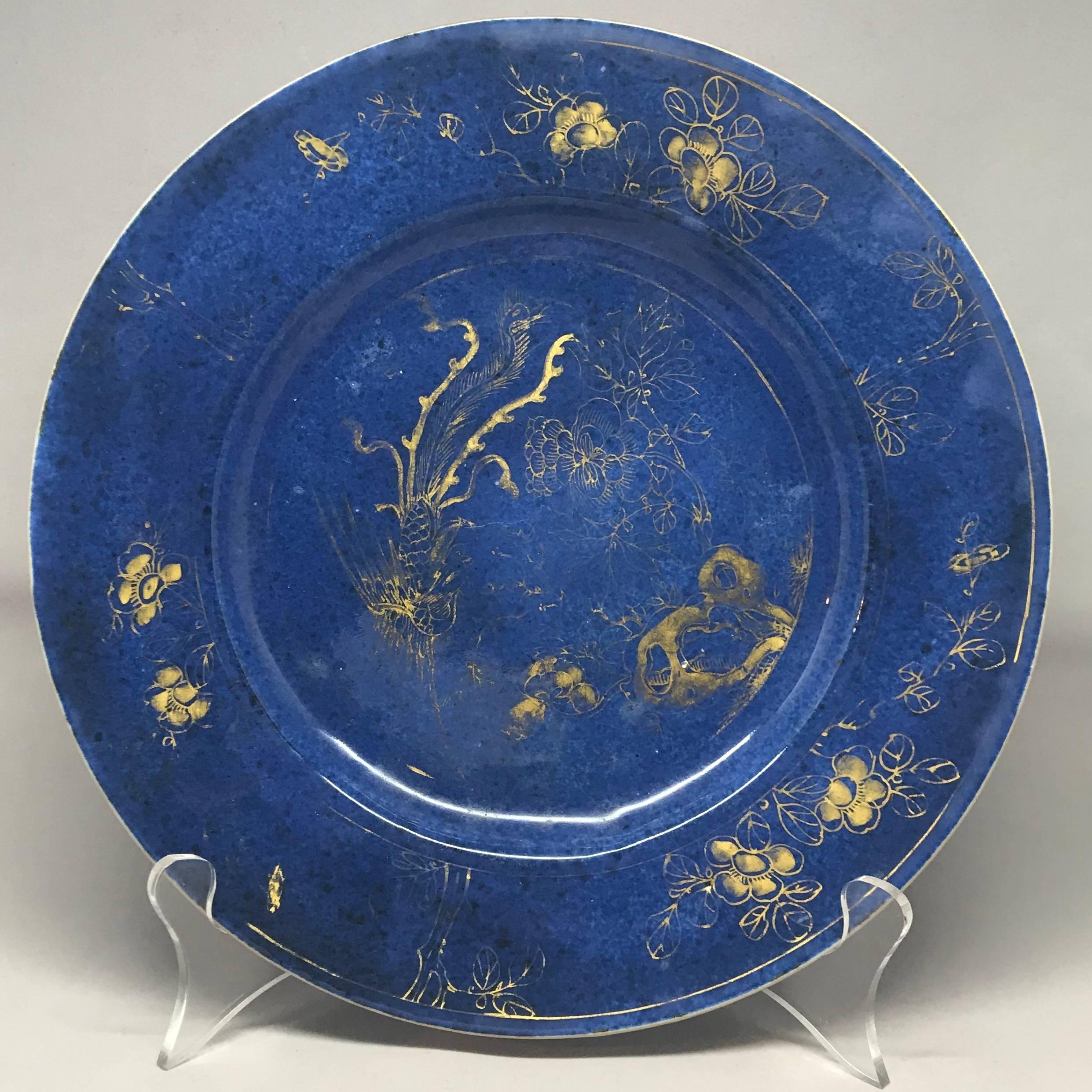 Powder blue and gilt Kangxi period plate.  Antique Chinese powder blue ground and gilt decorated plate, with additional gilt decoration to the underside. Kangxi Period, circa 1662–1722.
Dimension: 9.25" diameter.