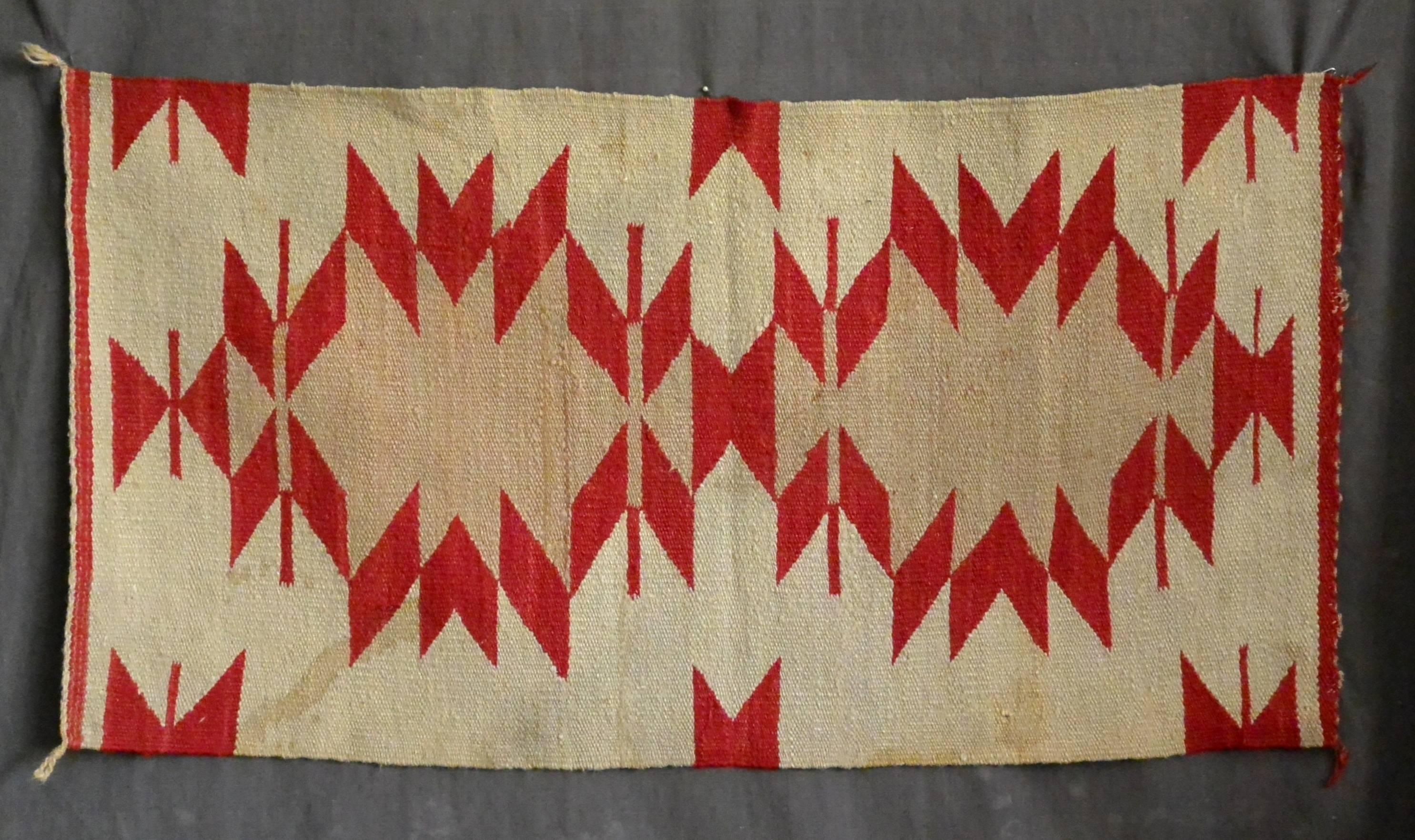 Native American Blanket.  Antique flat-woven cream, camel and red wool American Indian saddle blanket of geometric design.  Handsome modern design wall hanging.   North America, late 19th century. 
Dimension: 20