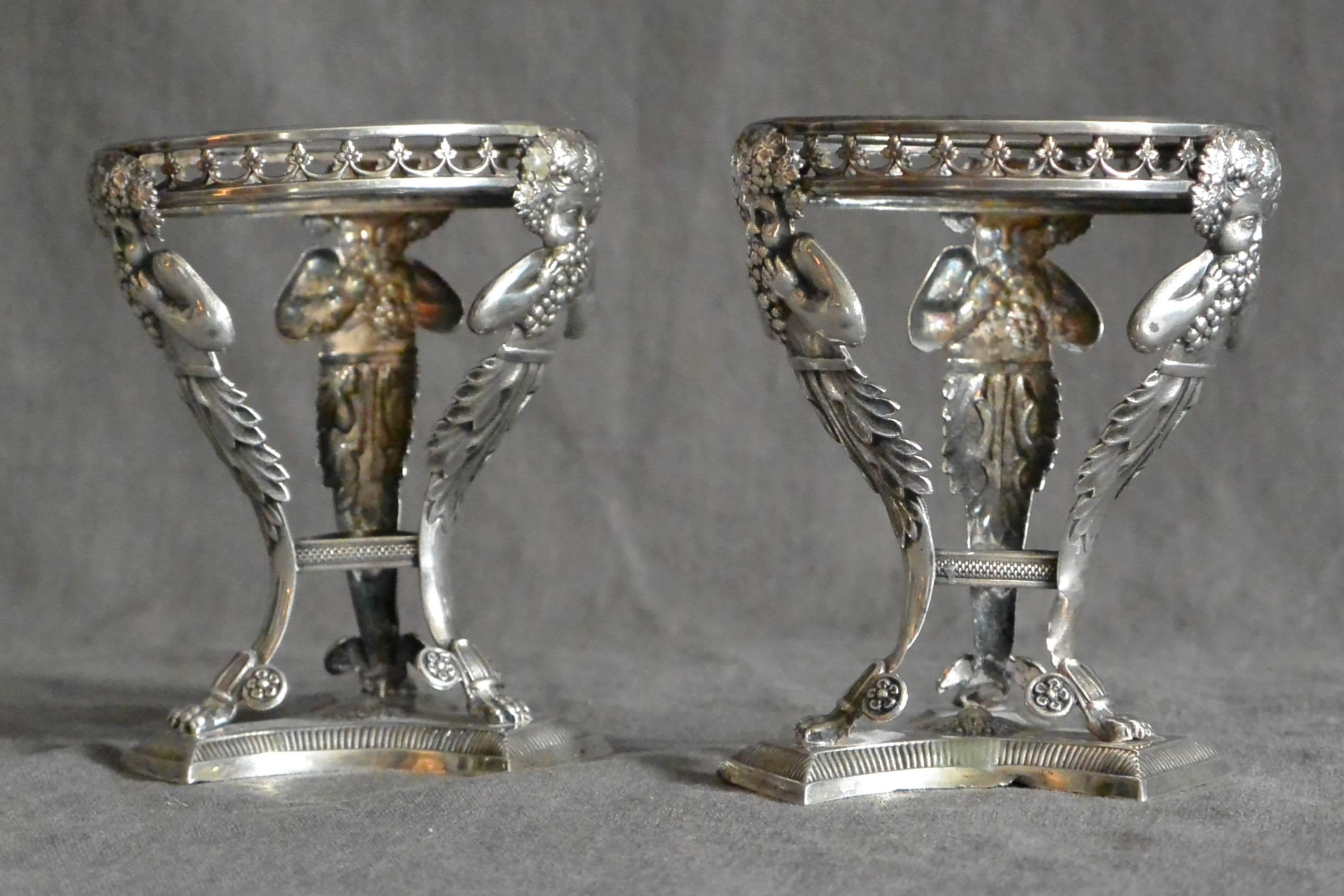 Pair of Italian Silver Salts with Bachii. Pair rare sterling silver tripod form salt cellars with Bacchus hermes on in-curving incised base. Italy, late 18th century. 
Dimension: 2.75