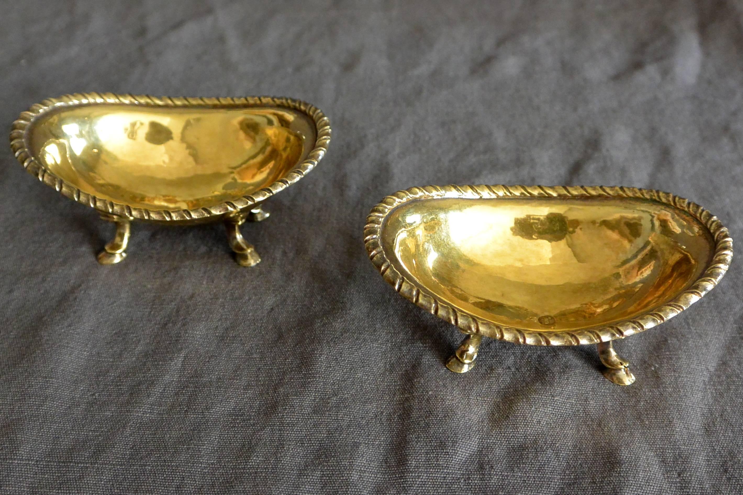Pair of exceptional vermeil salt cellars with cord incised rims on hoof feet, Italy, 18th century. Stamped LF with goat. 
Dimension: 3.88