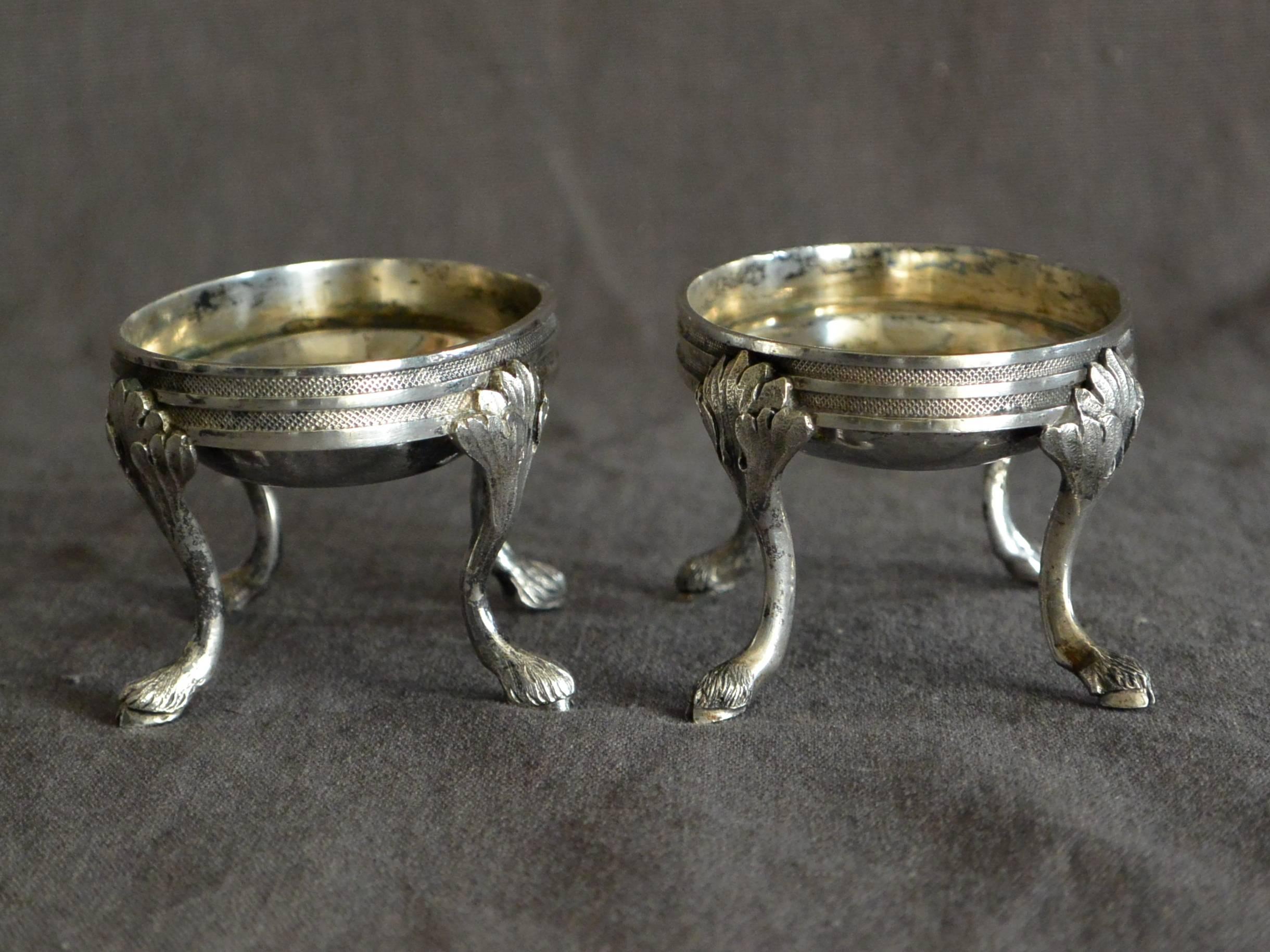 Pair of Austrian silver oval salts. Pair early 19th century Austrian sterling silver oval triple banded and incised salt cellars on foliate legs terminating in hoof feet. Stamps and marks 
