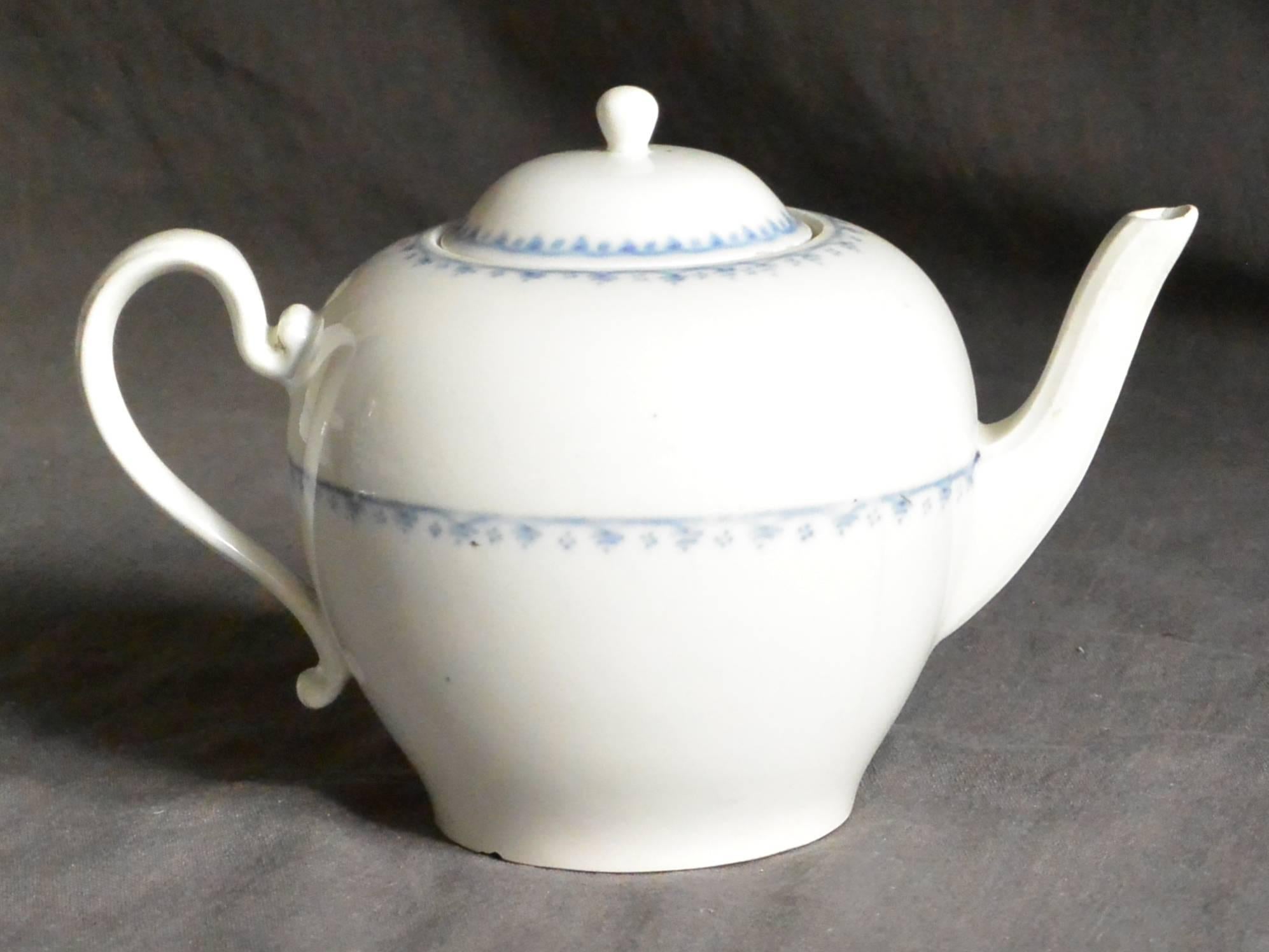 Blue and white Vienna porcelain teapot.  White porcelain teapot with delicate blue banding. Underglaze blue marking for Vienna; impressed 