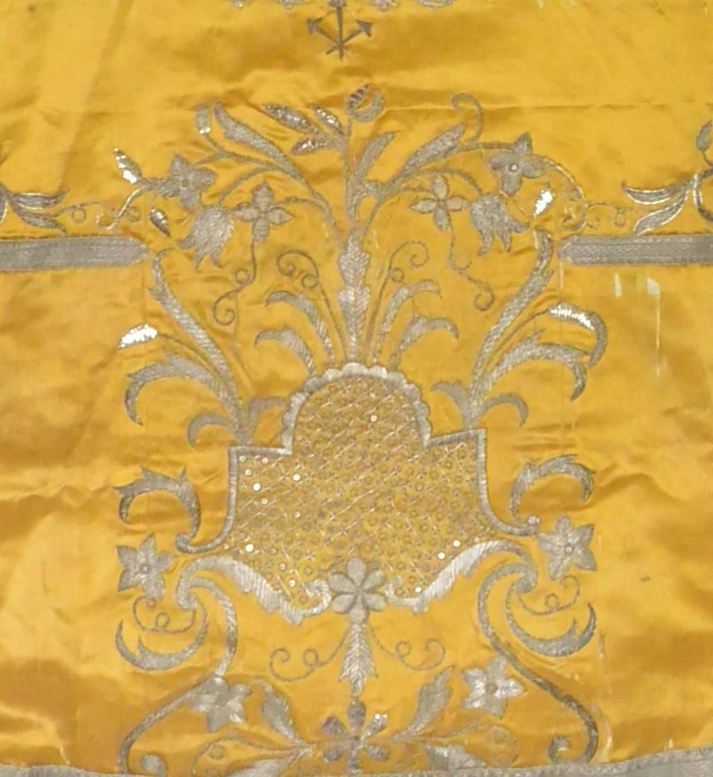 Silver thread embroidered yellow silk chasuble cape. Exquisite antique Neapolitan hand-embroidered silver thread on yellow silk chasuble from a private family chapel.  Italy, late 18th century. 
Dimension: 28