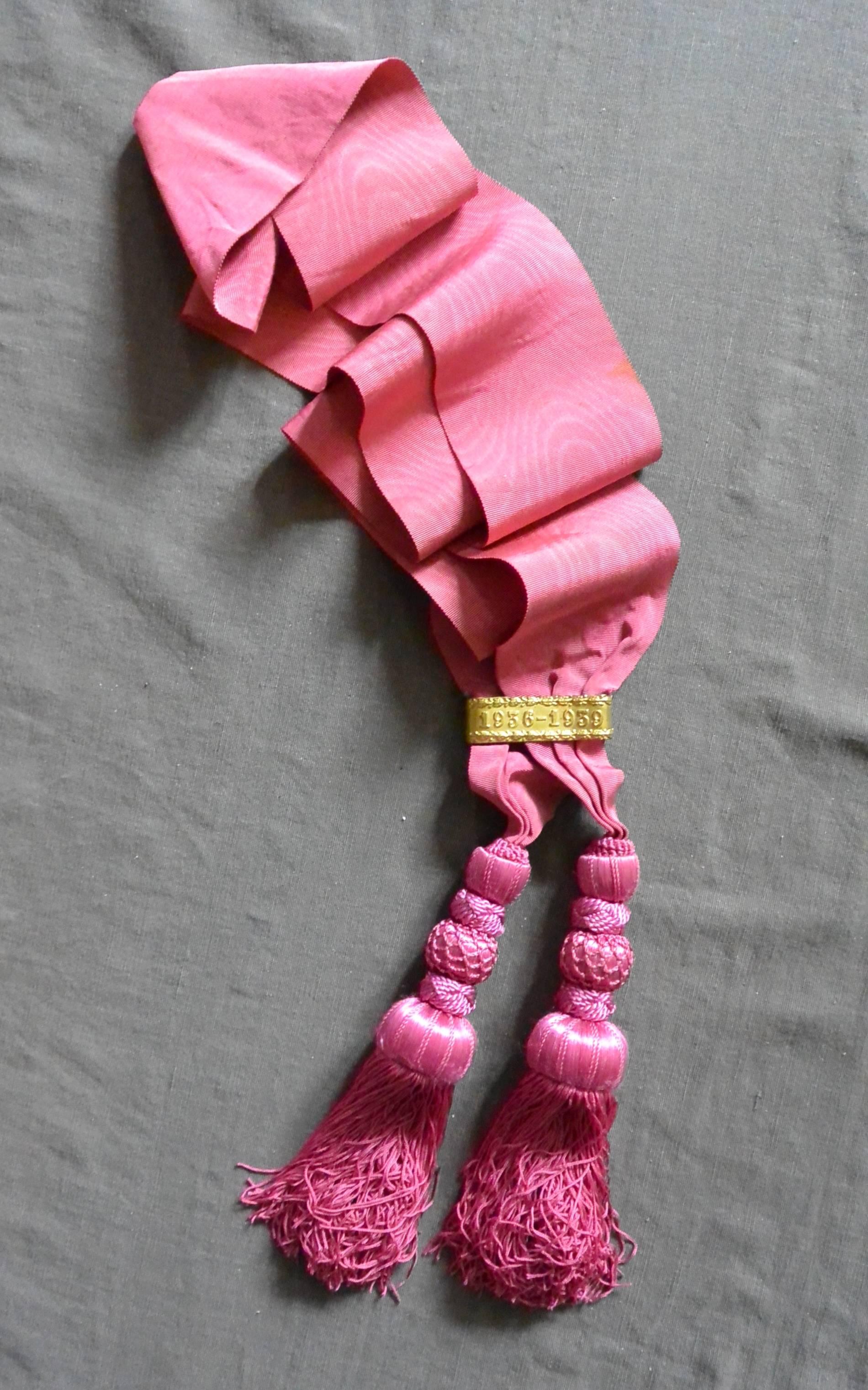 Spanish pink grosgrain sash with tassels and gilt metal embossed clasp 