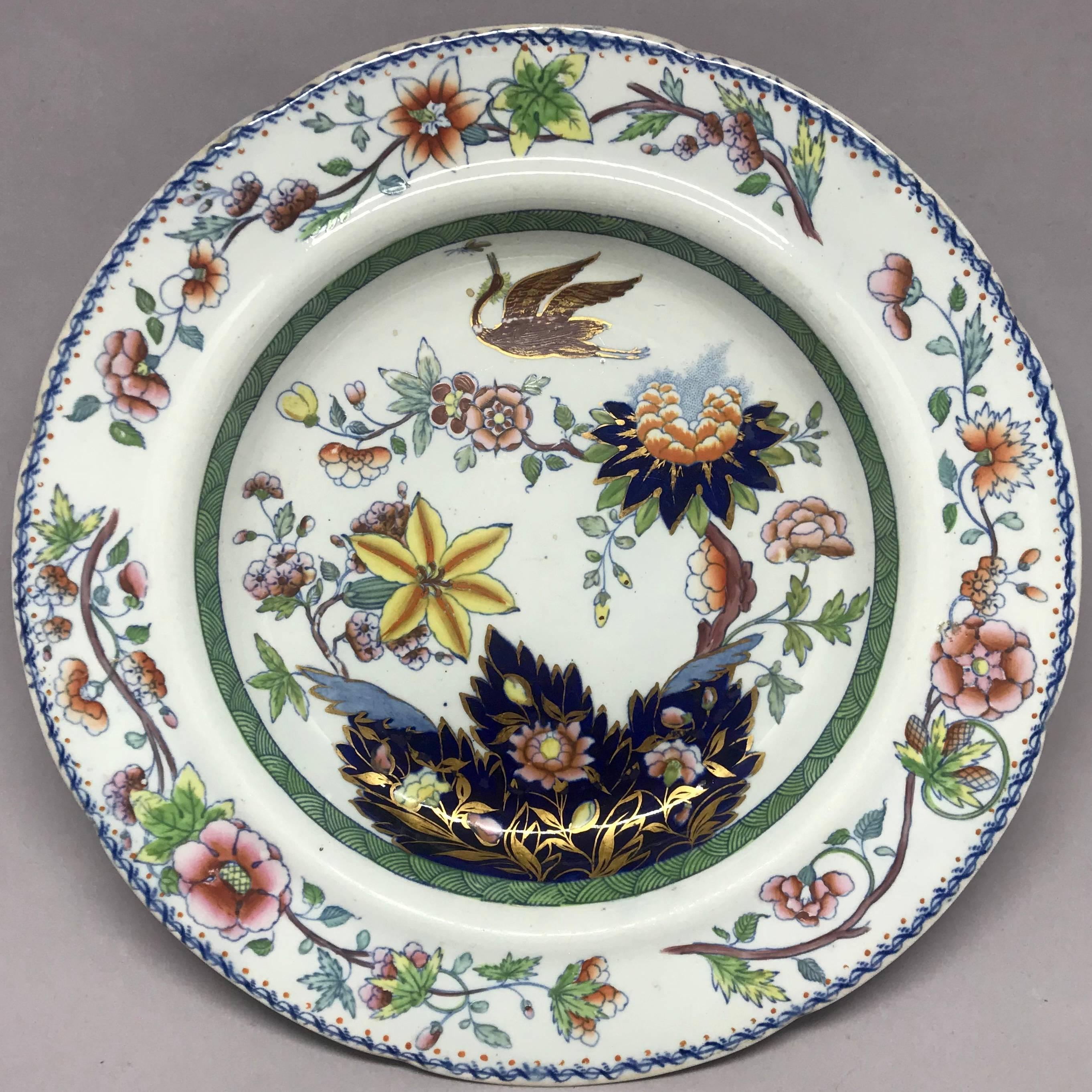 Davenport chinoiserie plate.  Antique plate with flowers and crane in blues, yellows, greens & gilt outlines. Underglaze blue marks for Davenport Stone China. England, circa 1815. 
Dimension: 9.63