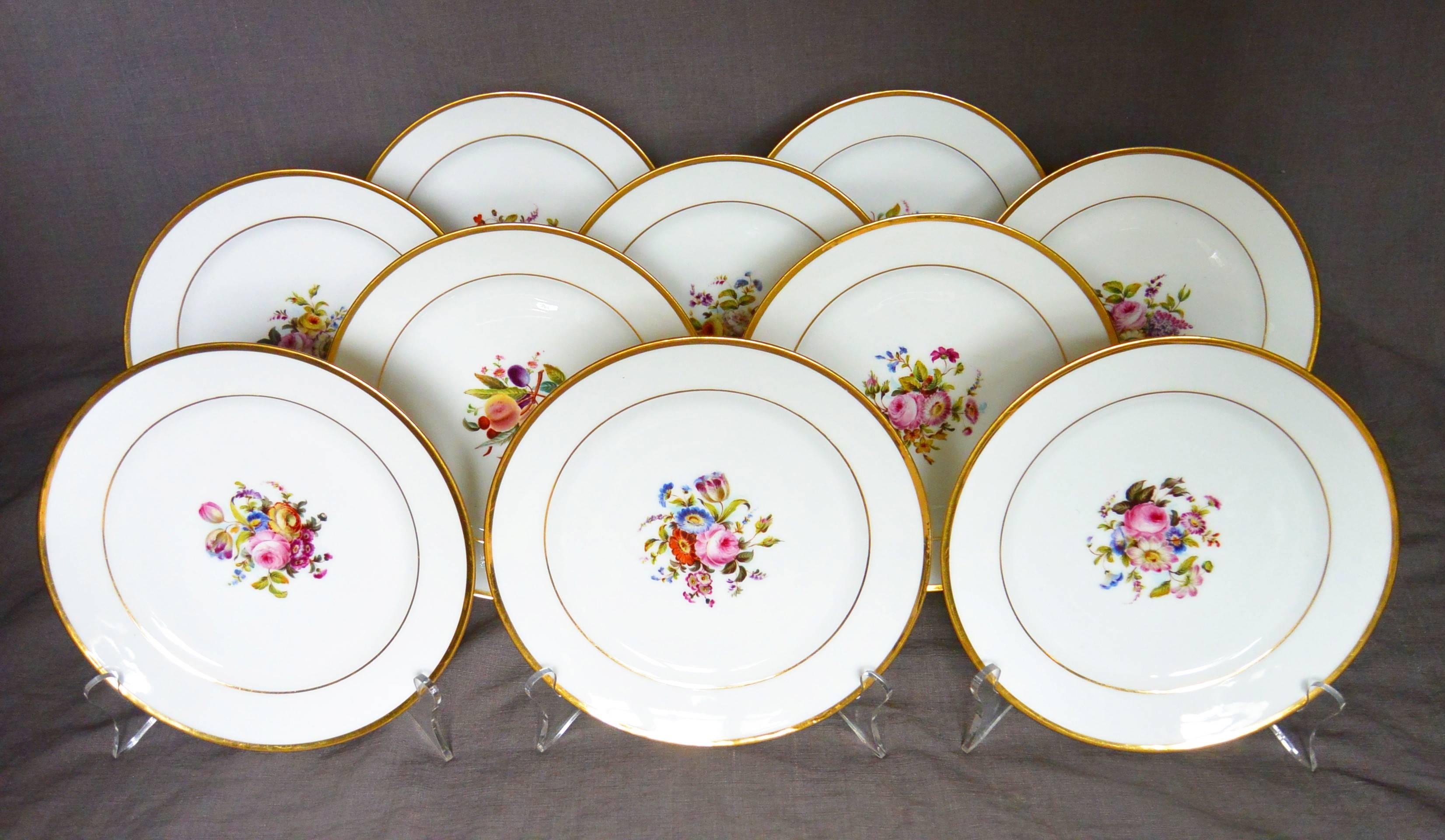 Antique set of ten Empire white and gilt plates with center floral bouquets; with underglaze red markings for L. Ernie 61 Rue du Bac., France, early 1800
Dimension: 8.25