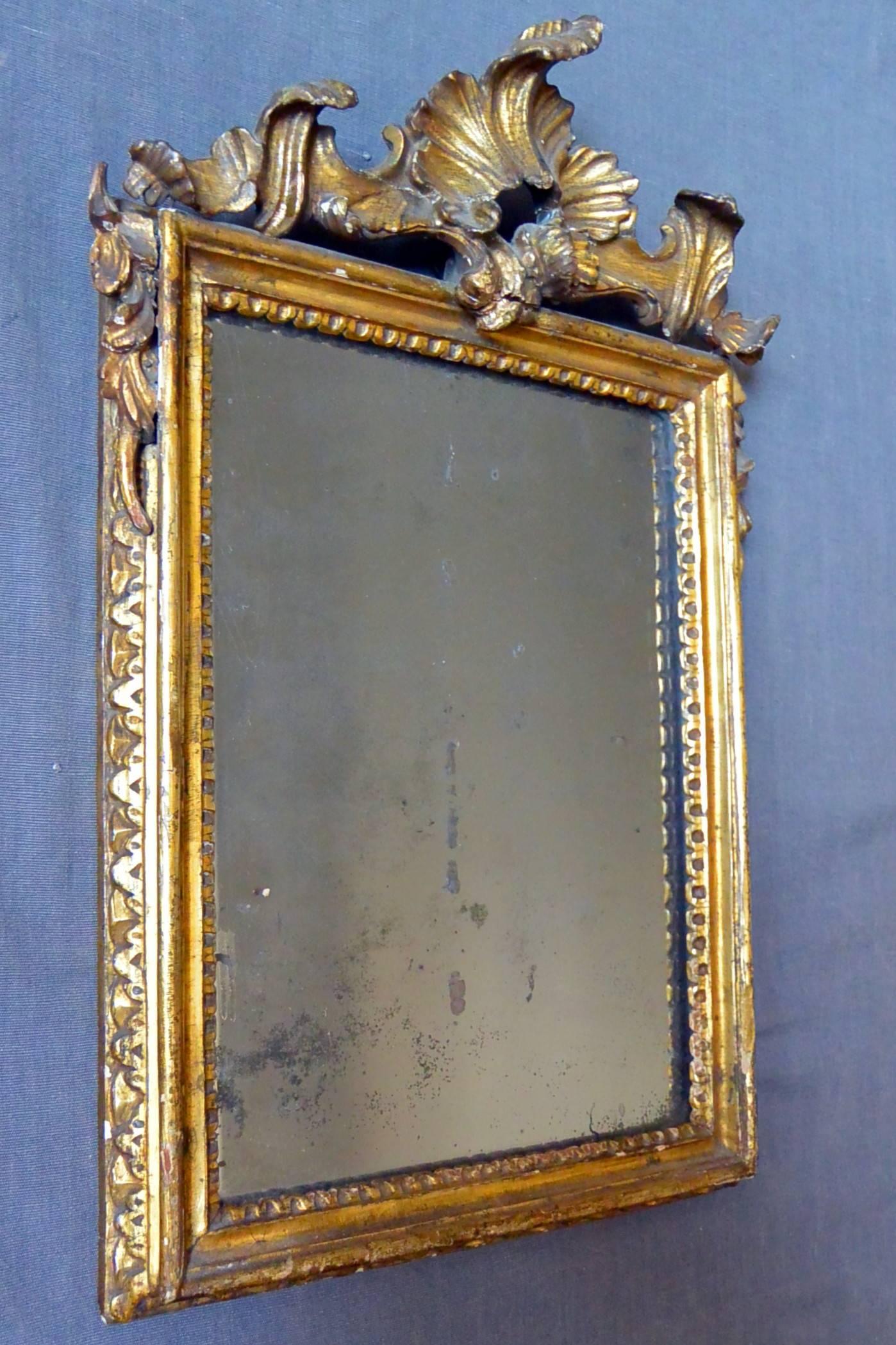 Rococo gilt carved mirror with original mirror plate, Italy, late 18th century. 
Dimension: 11