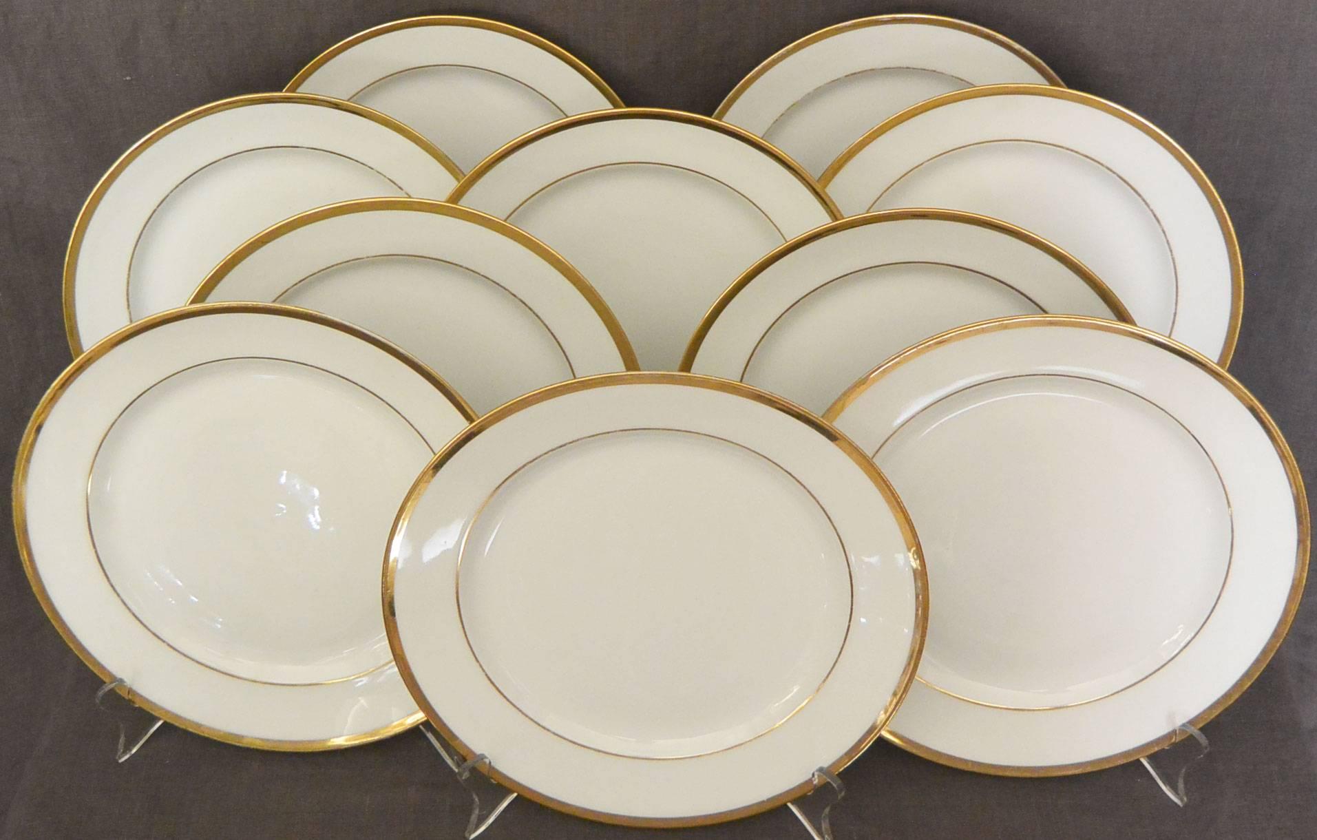 Set of ten white and gilt French Empire plates. Set of ten Empire white and gilt plates with under-glaze red markings for L. Ernie 61 Rue du Bac., France, early 1800. 
Diameter: 9.25