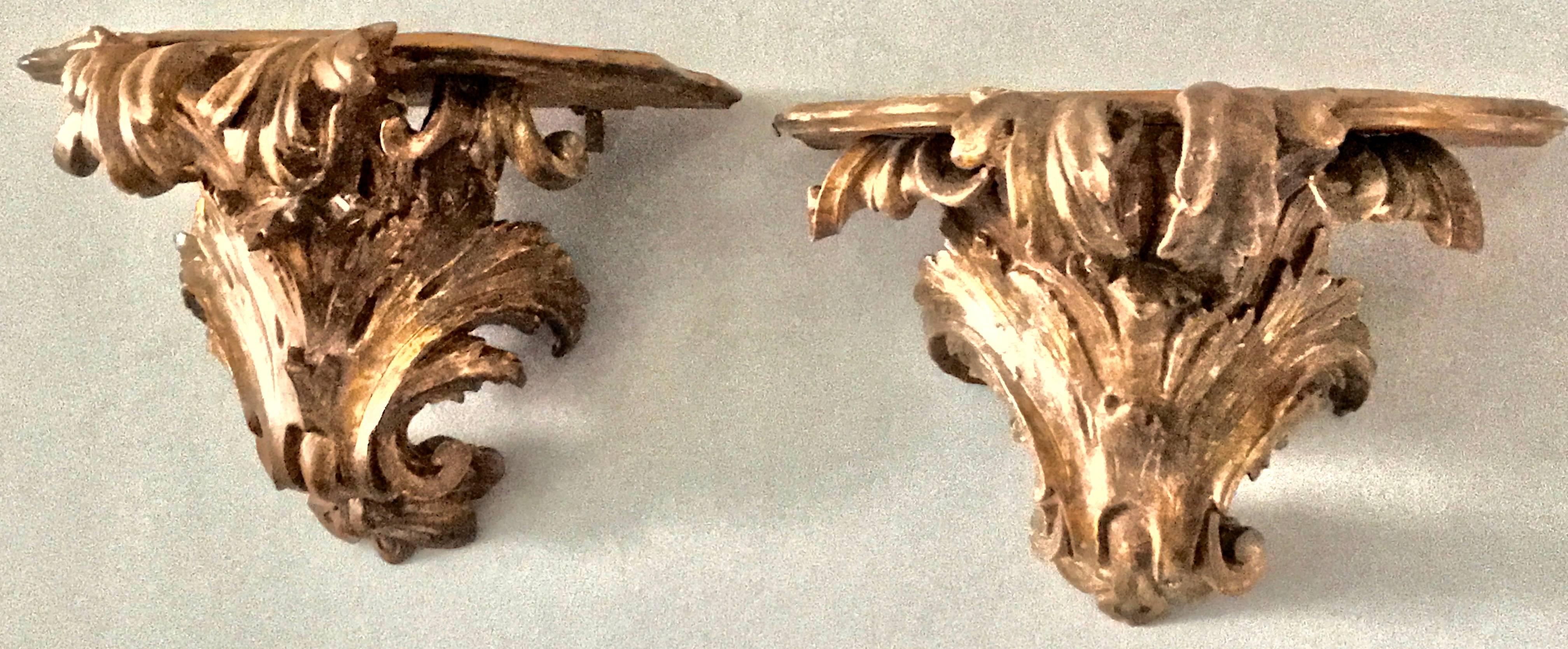 Pair large Italian gilt-carved brackets. Pair of gilt-carved brackets with rich silvered-gold patina and faux marble tops, Italy, circa 1770s
Dimensions: 20