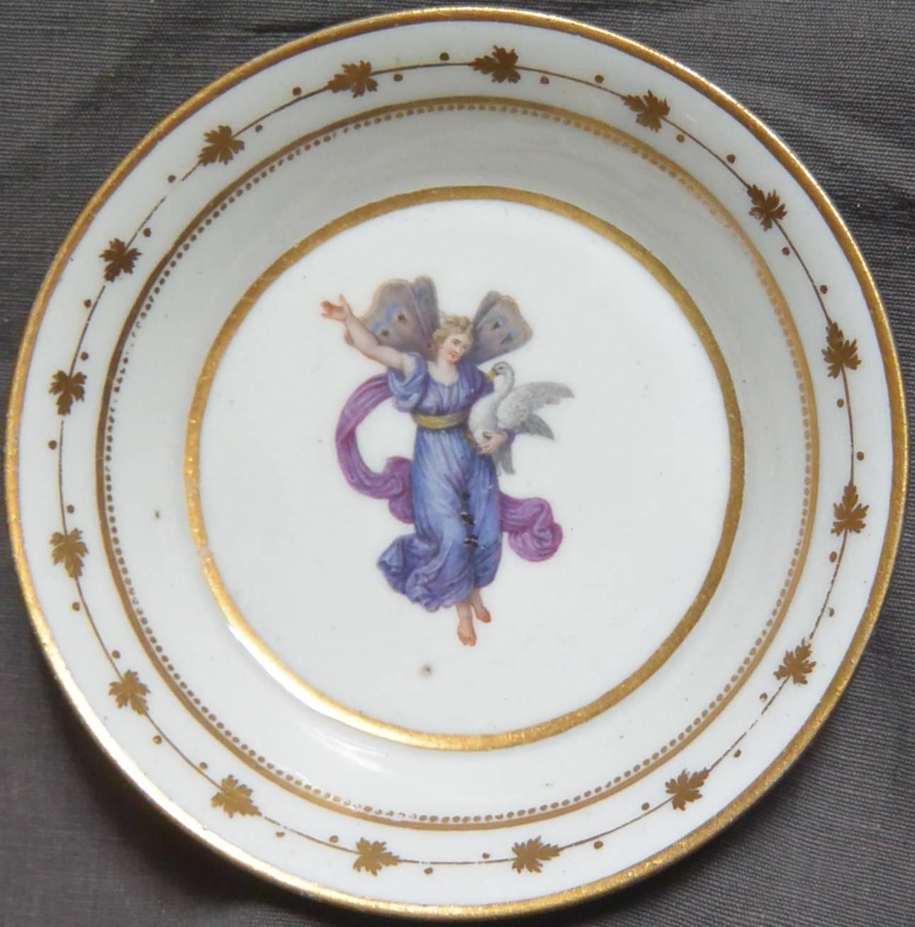 Neoclassical gilt decorated plate with mythological figure. Naples Real Fabbrica Ferdinandea white porcelain painted and gilt decorated saucer dish with Leda and the swan bordered by grape leaf banding. Italy, circa 1795
Dimension: 5.75
