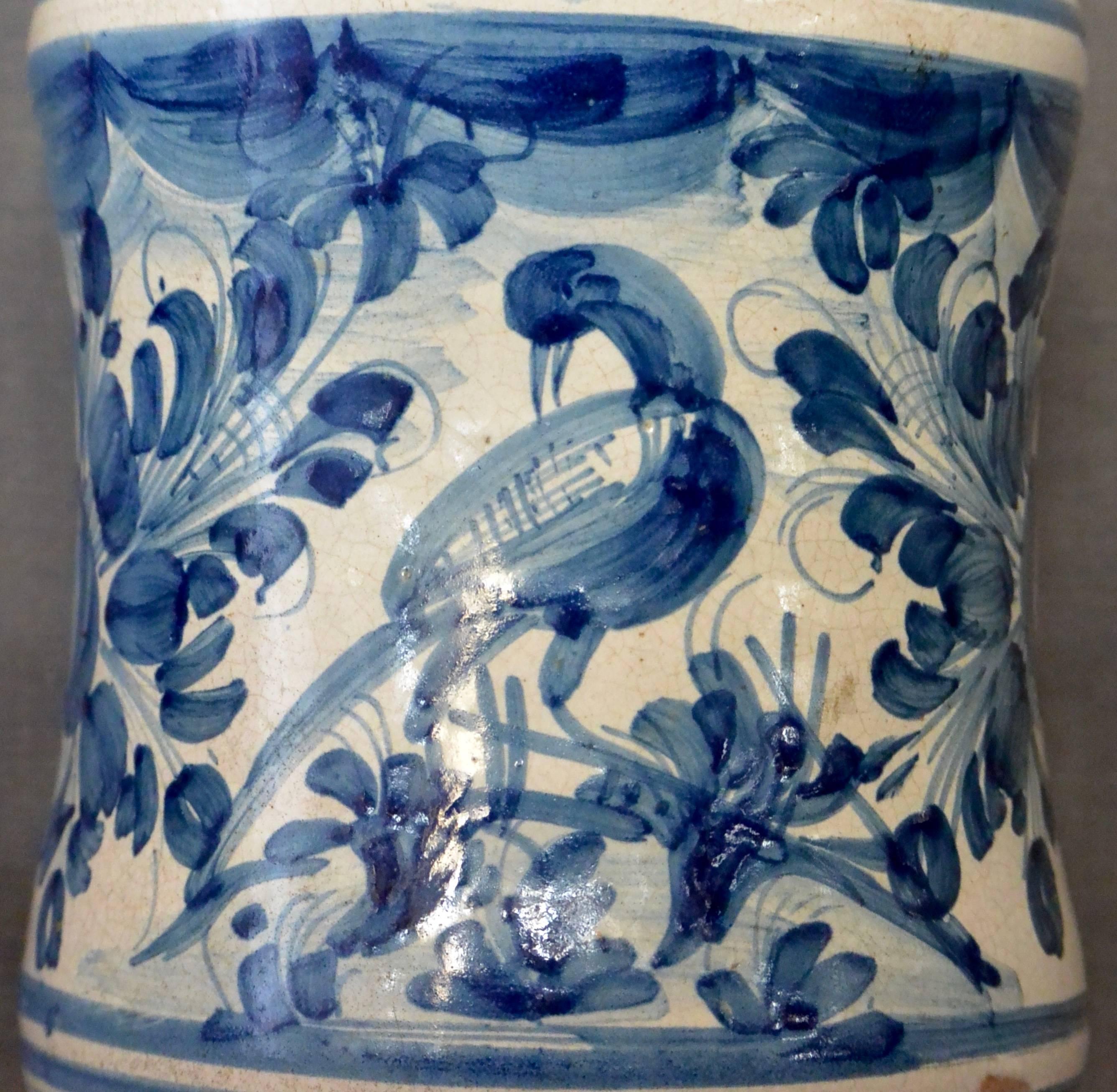 Blue and white ceramic Albarello jar or vase with hand-painted bird in foliage with magnificent blue tonal colouring in excellent original antique condition, Italy, circa 1640.
Dimensions: 6.25” diameter x 8.75” H; 5.75” diameter base.