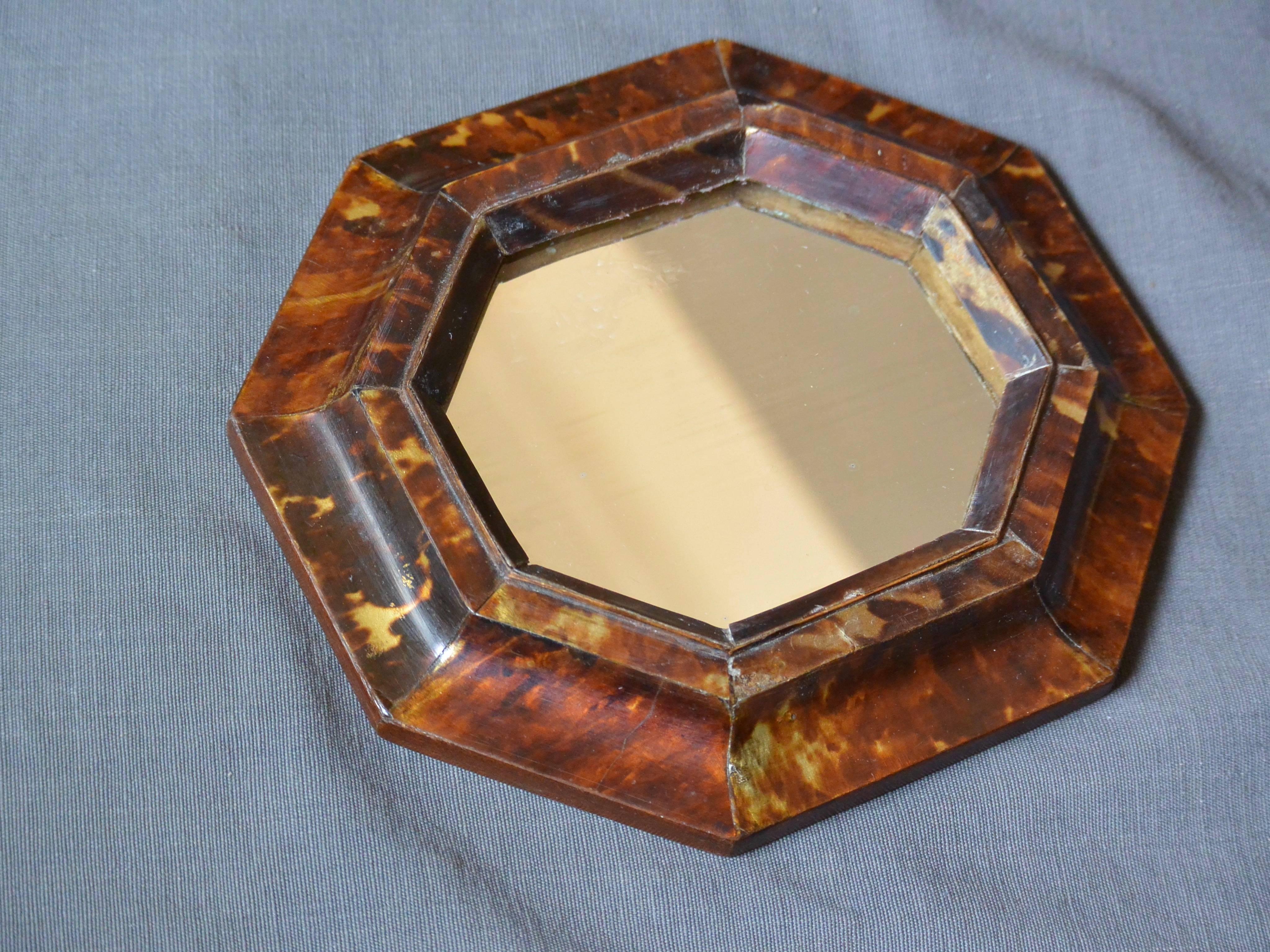 Small antique Sicilian octagonal tortoiseshell framed mirror with later antique mirror plate, Italy, circa 1860.
Dimensions: 6.88