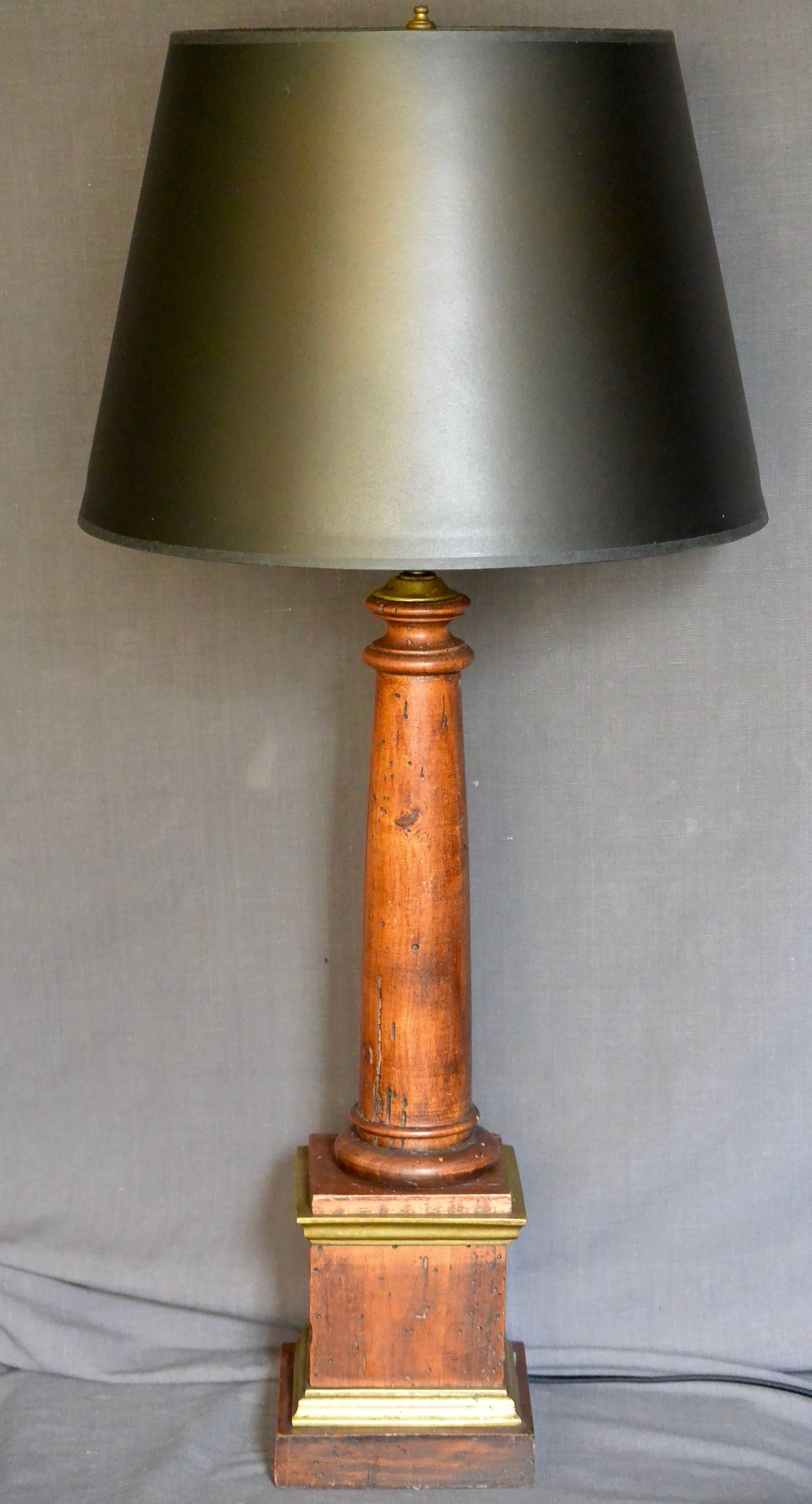 Italian wood column lamp. Vintage neoclassical style columnar double light table lamp on pedestal with brass fittings. Newly electrified with black silk cord. Vintage gold lined black card shade optional. 
Dimensions: 5.5
