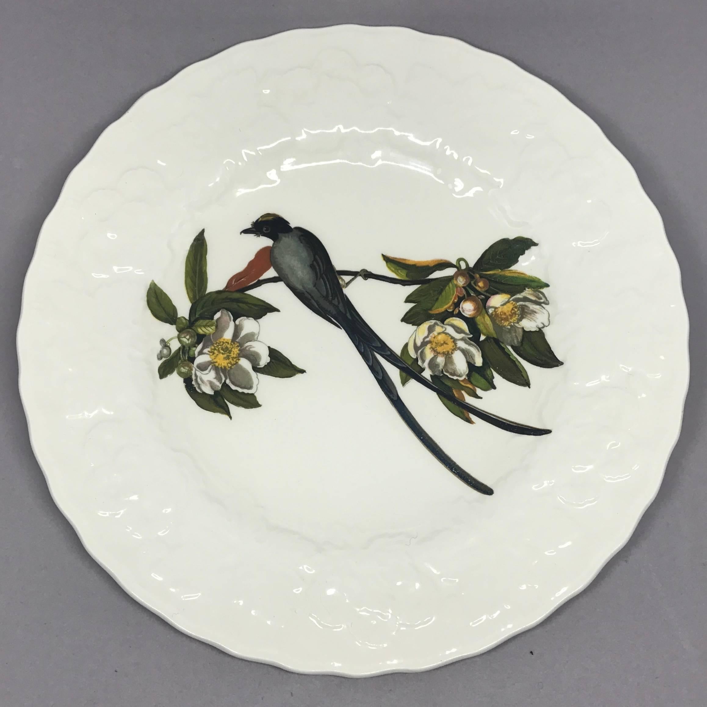 Set of eight Audubon birds of America plates in cream with raised floral border centering on eight different birds. Alfred Meakin, England, circa 1940. 
One cedar bird #43
One band tailed pigeon #62
One white crowned sparrow #114
One fork tailed