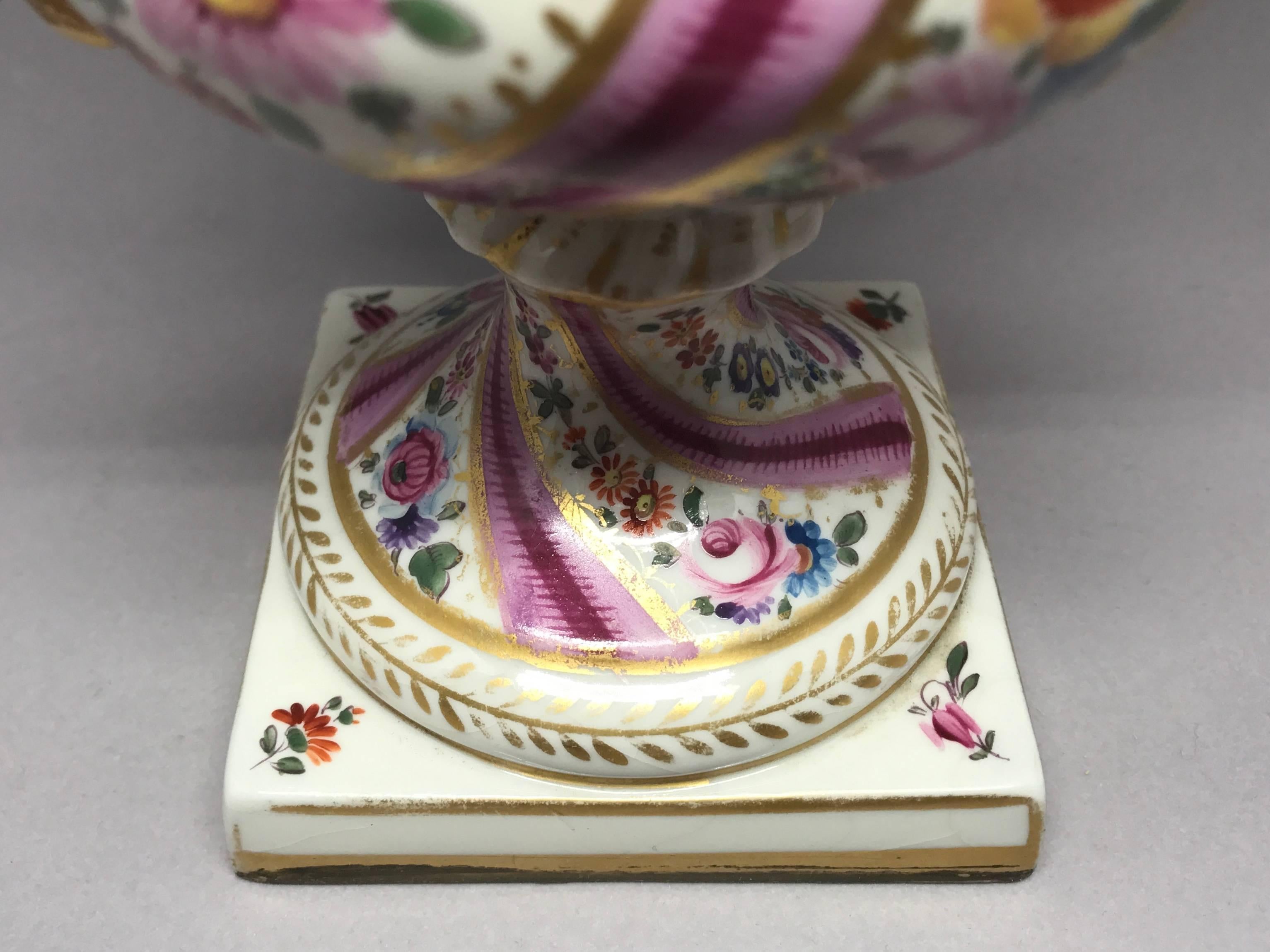 Pair Pink Floral and Gilt Porcelain Painted Urns For Sale 1