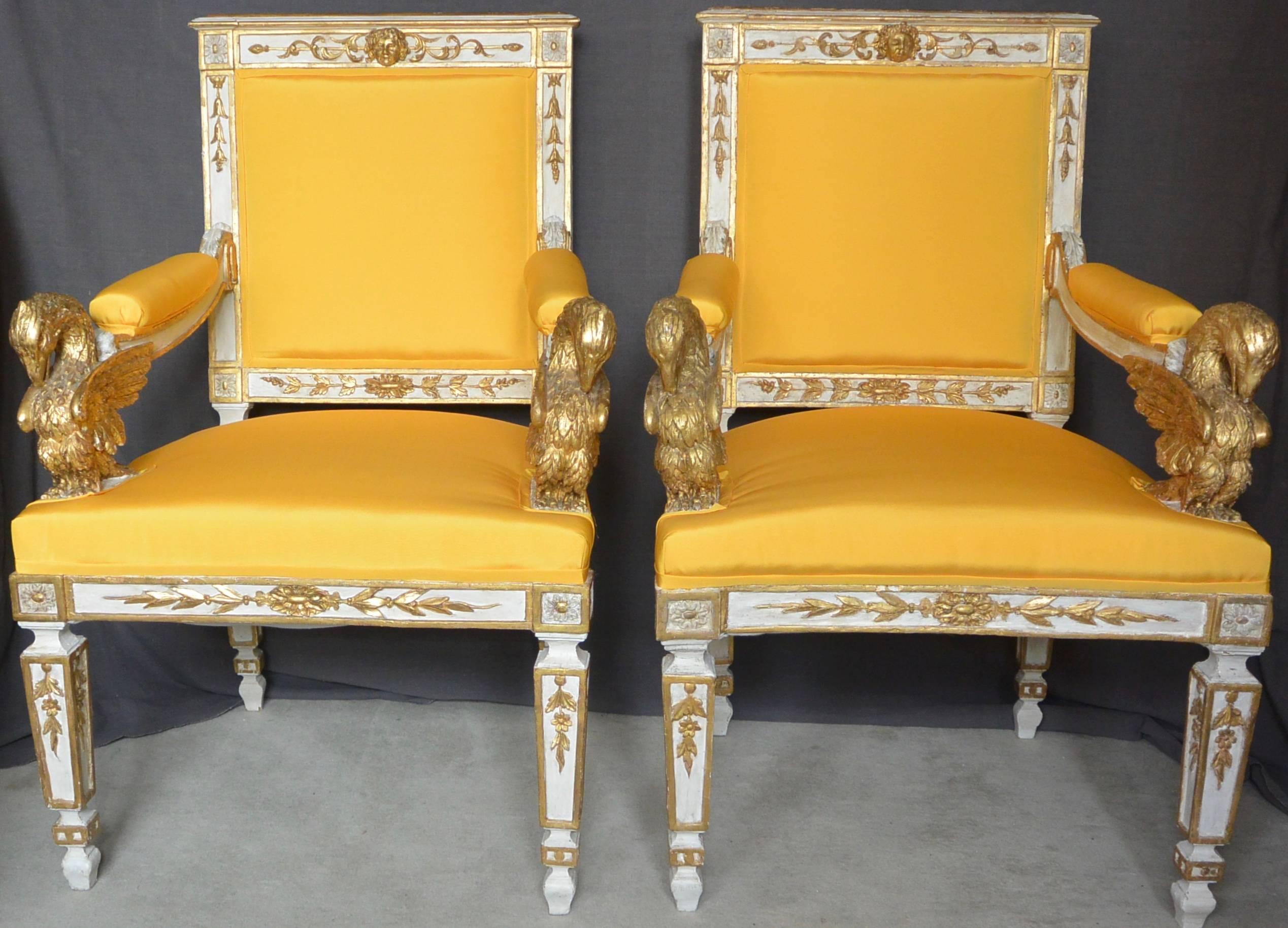 Pair eagle armchairs in yellow taffeta. Italian Empire painted and parcel-gilt carved armchairs with finely carved eagle arm terminals and yellow Italian silk taffeta. Newly re-upholstered and re-enforced, Northern Italy, early 1800s. 
Dimension: