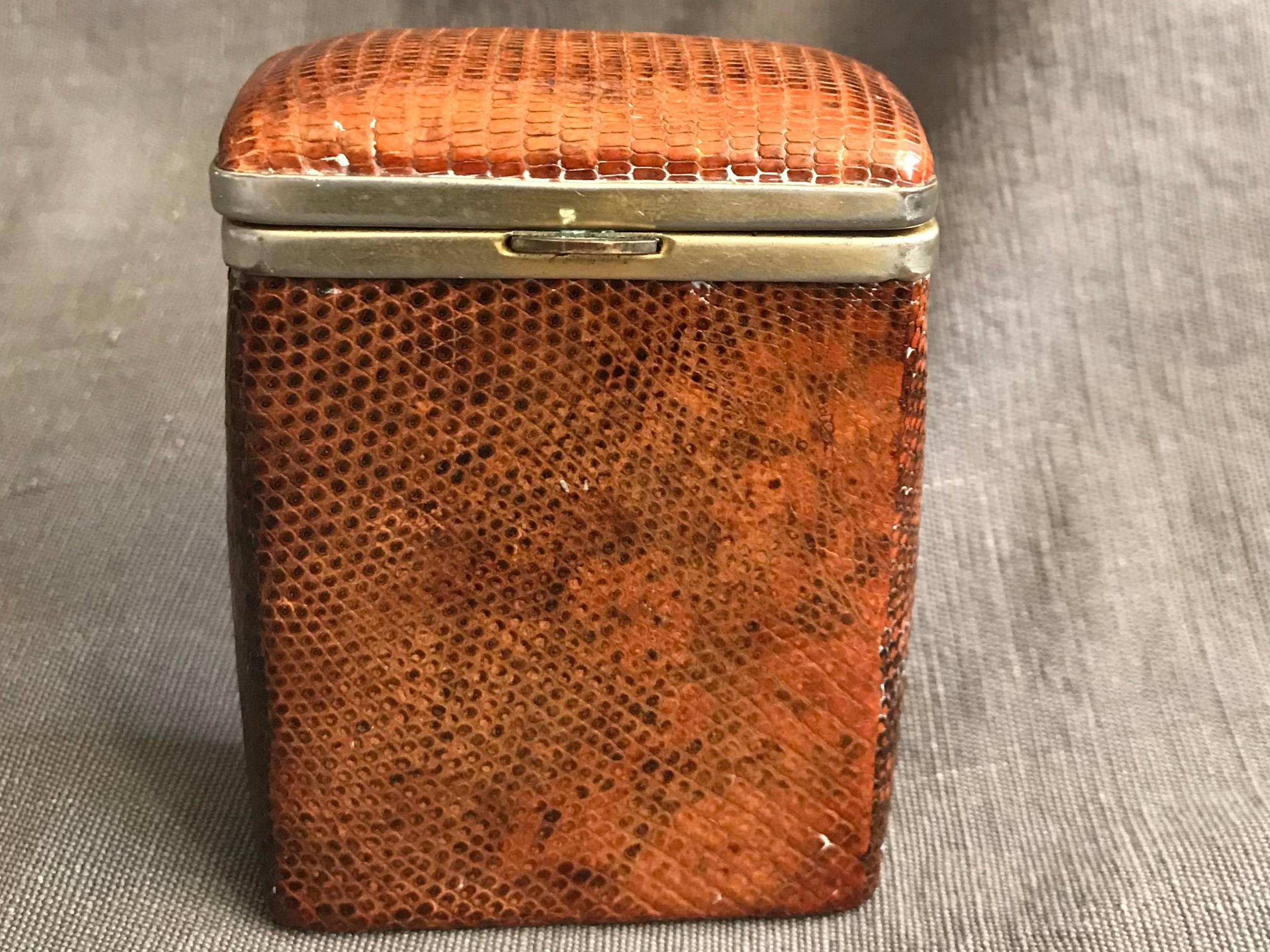 English snake skin cigarette case. Vintage spring-action top in rich caramel colored snake skin cigarette case, England, circa 1940s.