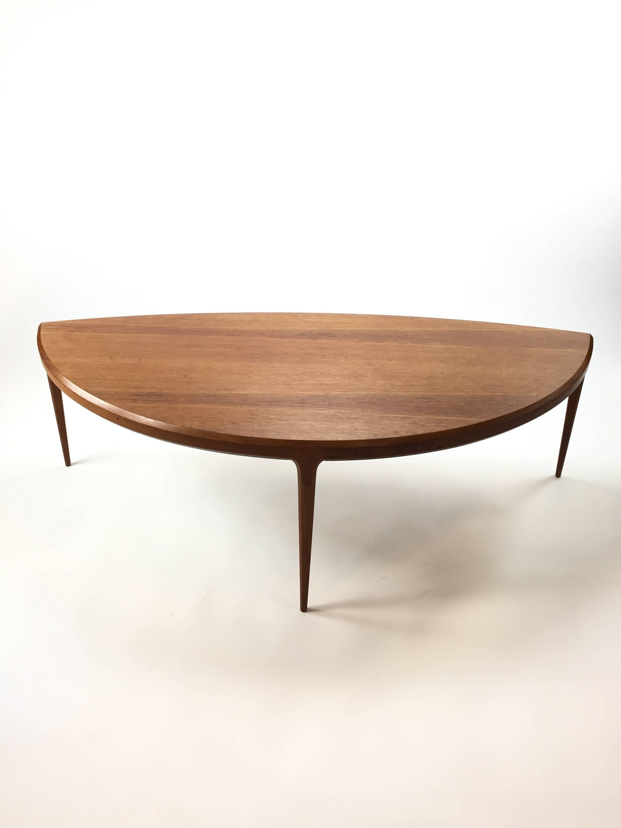 Oval demilune shaped cocktail table by Johannes Andersen for CC Silkeborg. Teak, Denmark, circa 1960.