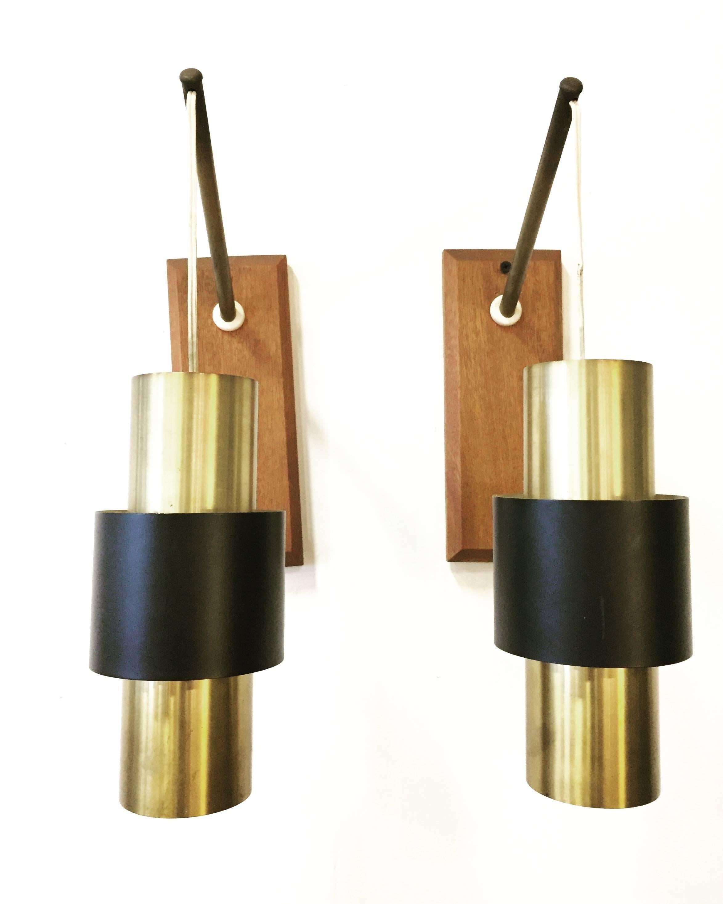 Awesome Mid-Century Danish sconces by Jo Hammerborg. The Saturn series is aptly names for the ring around the central body that gives the illusion of floating and celestial drift. As found, very good condition.