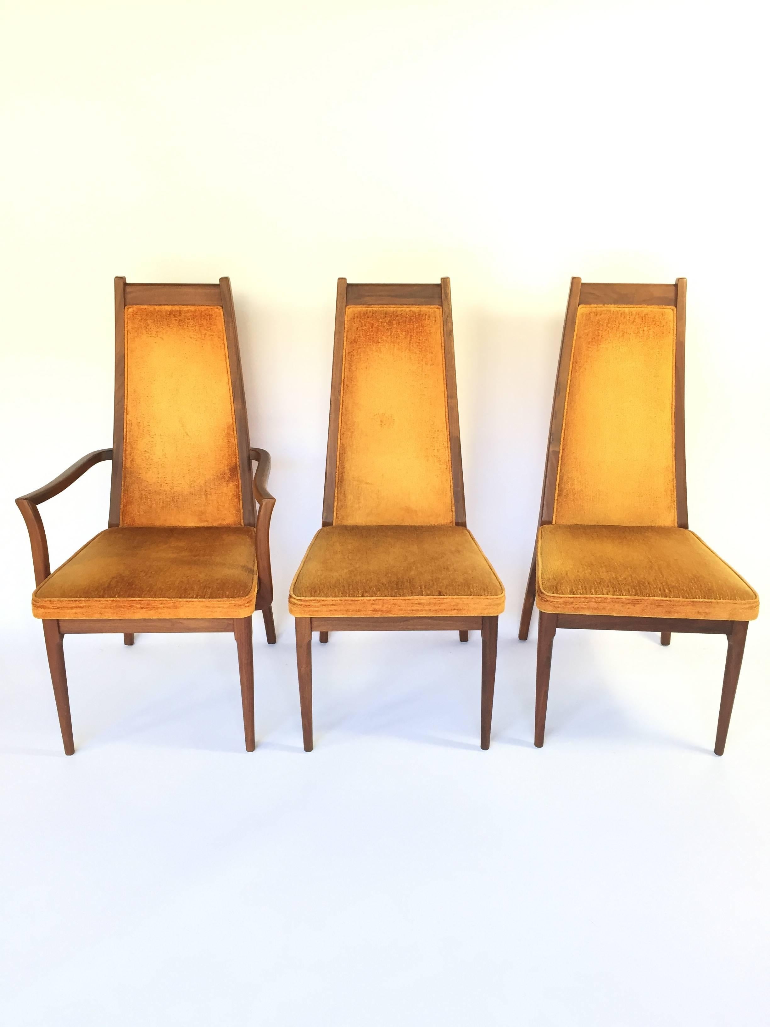 Gorgeous Mid-Century Modern walnut dining chairs with orange upholstery. High back form factor makes these chairs very comfortable, while the organic curves of the legs and arms scream Mid-Century chic. In pristine condition. Includes two armchairs
