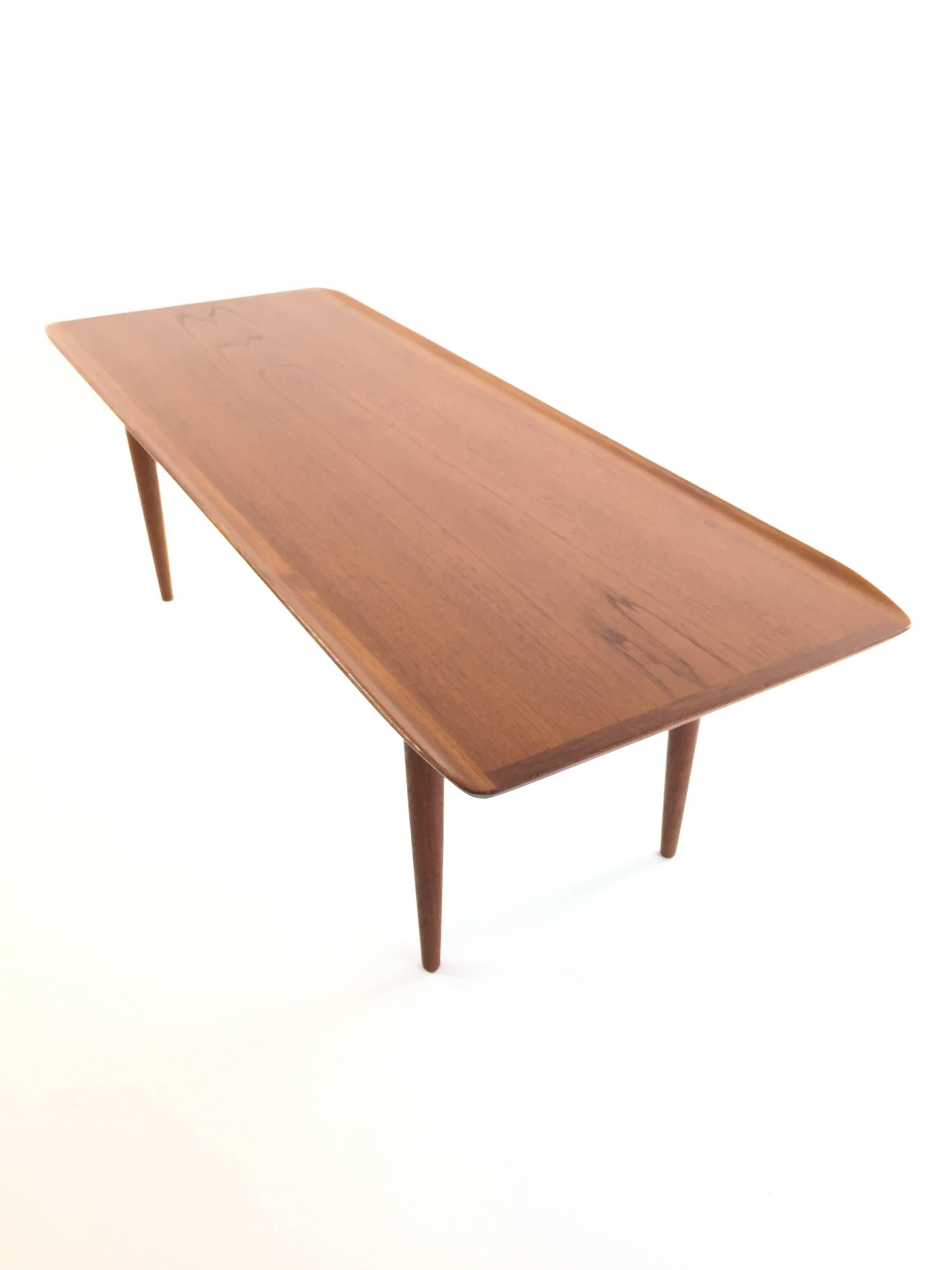 Lovely elongated midcentury teak coffee table.