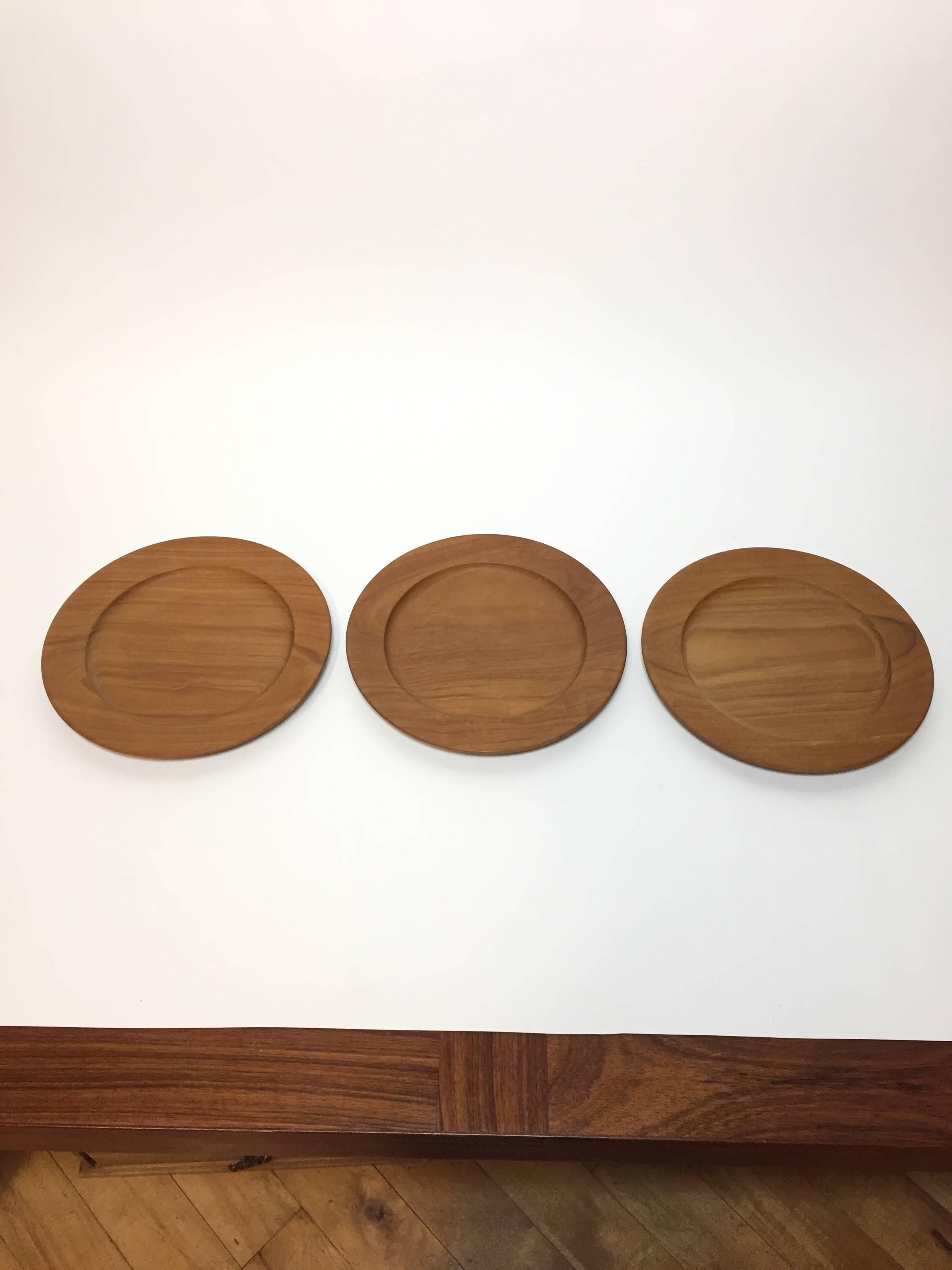 Three vintage teak chargers/trays by Danish midcentury designer Kay Bojesen. Made in Denmark.