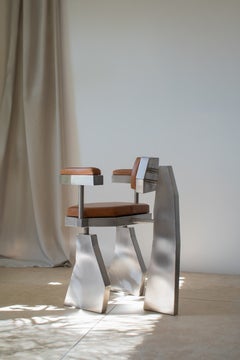 Sillón «Heron» de Vincent Decat: diseño moderno en piel y acero