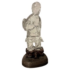 Figurine chinoise ancienne en cristal de roche sculpté représentant un immortel