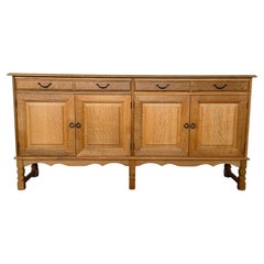 Danish Oak Sideboard with Turned Legs and Carved Apron, Henning Kjærnulf, 1970s