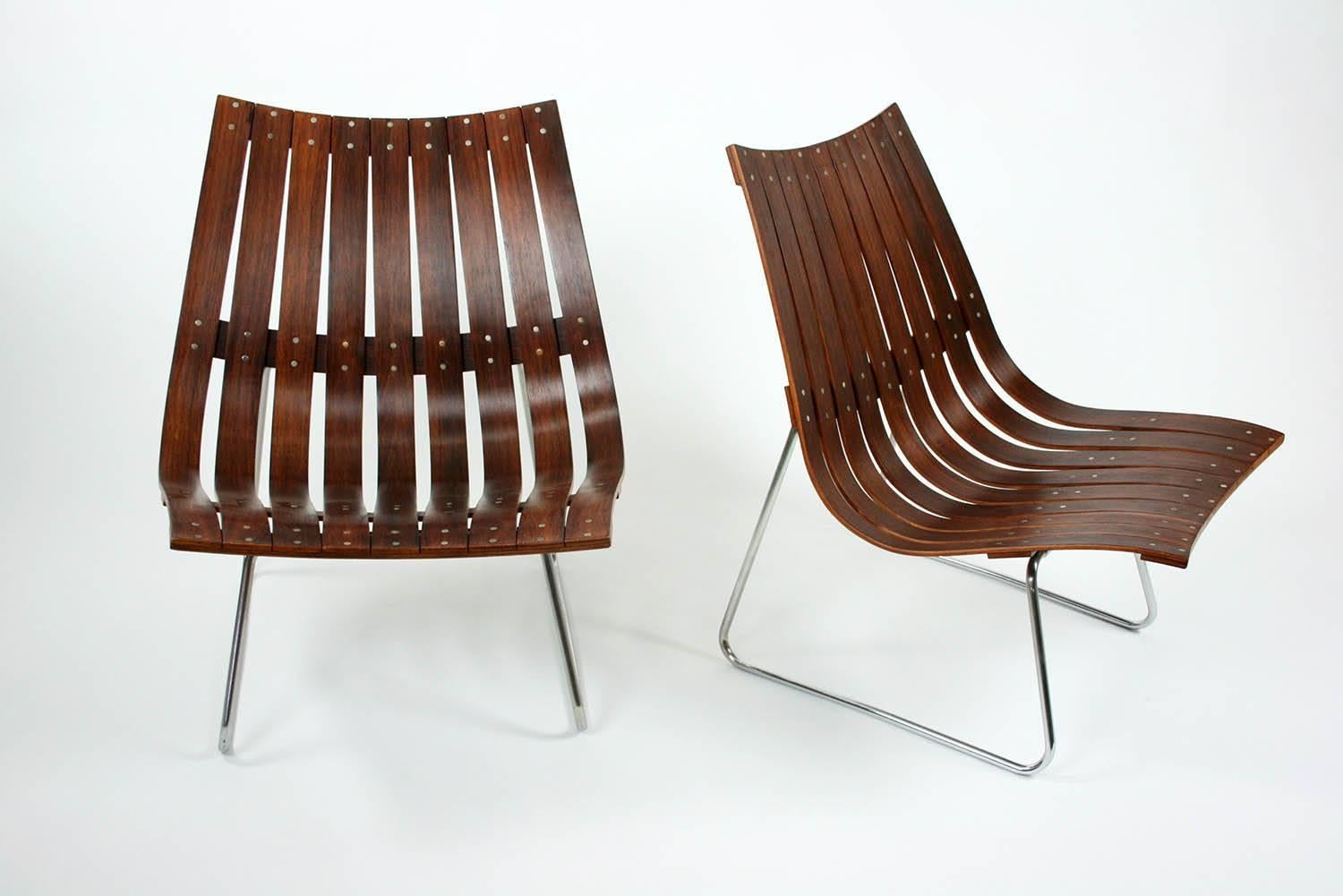 Pair of Kjell Richardsen Tynes möbelfabrik rosewood lounge chairs circa 1960. The shape and ingenious construction makes this a timeless piece. These have been completely restored to their original state. The rosewood is again bright and the chrome