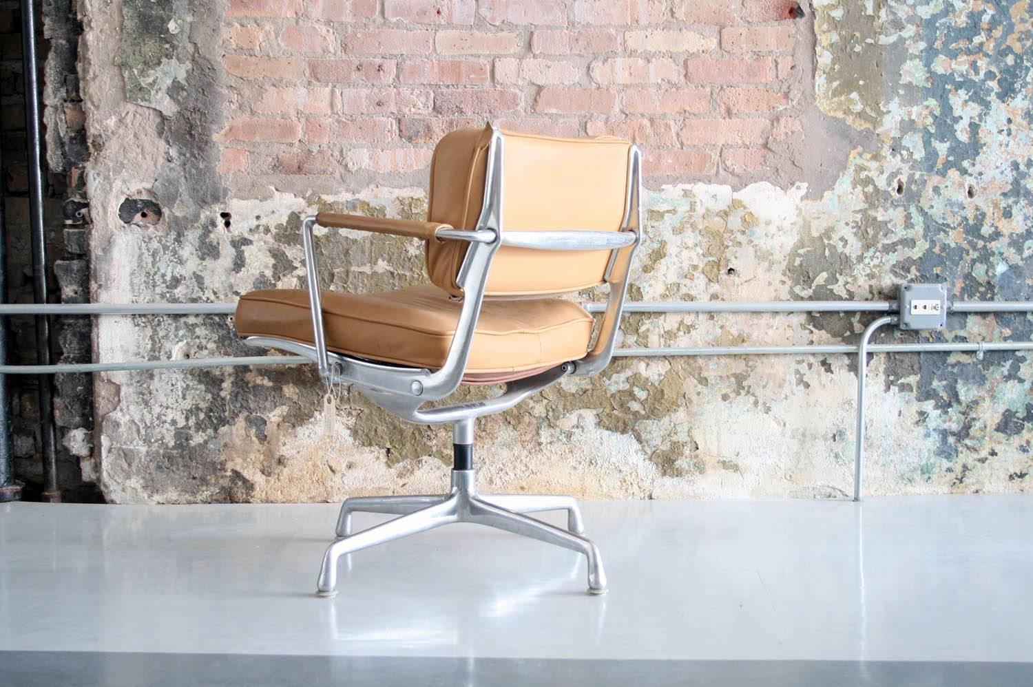 Charles and Ray Eames Intermediate chair in original leather upholstery and cast aluminium frame
introduced in 1968.

Charles and Ray called this design “intermediate” because it was intermediate in price and weight compared to other Eames