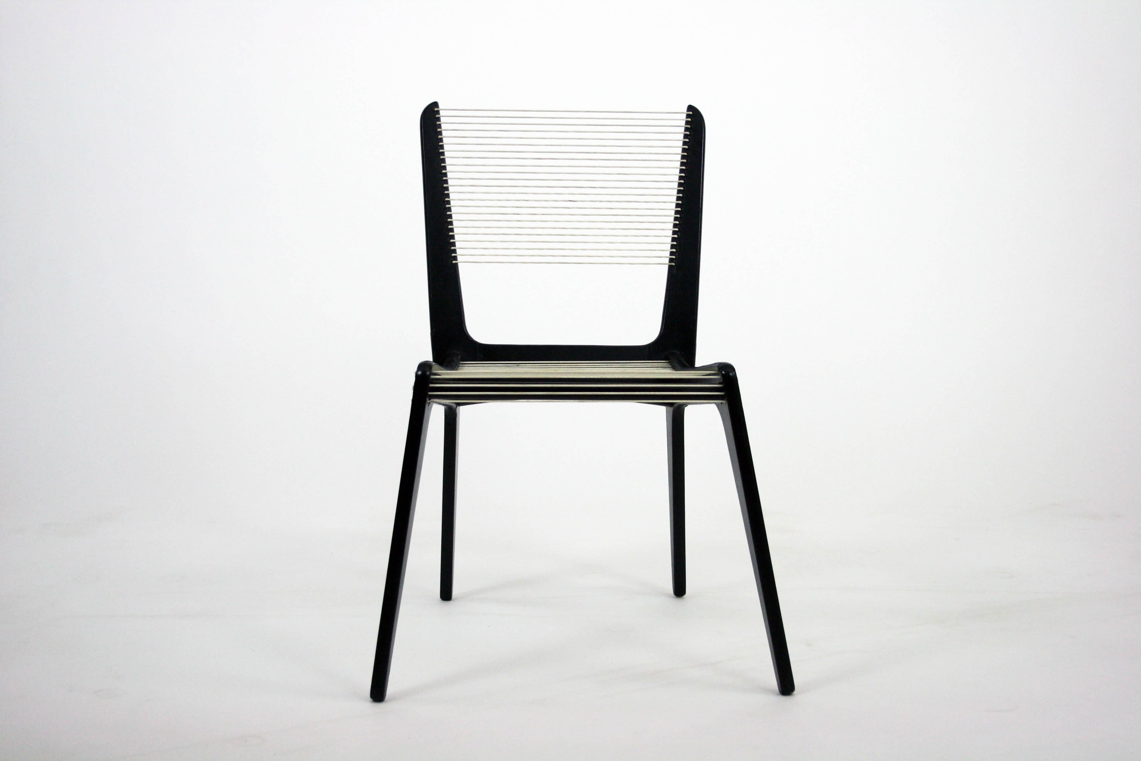 This spare and stylish chair was designed by Jacque Guillon in Montreal, Canada. Designed in 1953, the chair was first introduced during the 1954 Milan Triennale. The lines are great and it is surprisingly comfortable. 