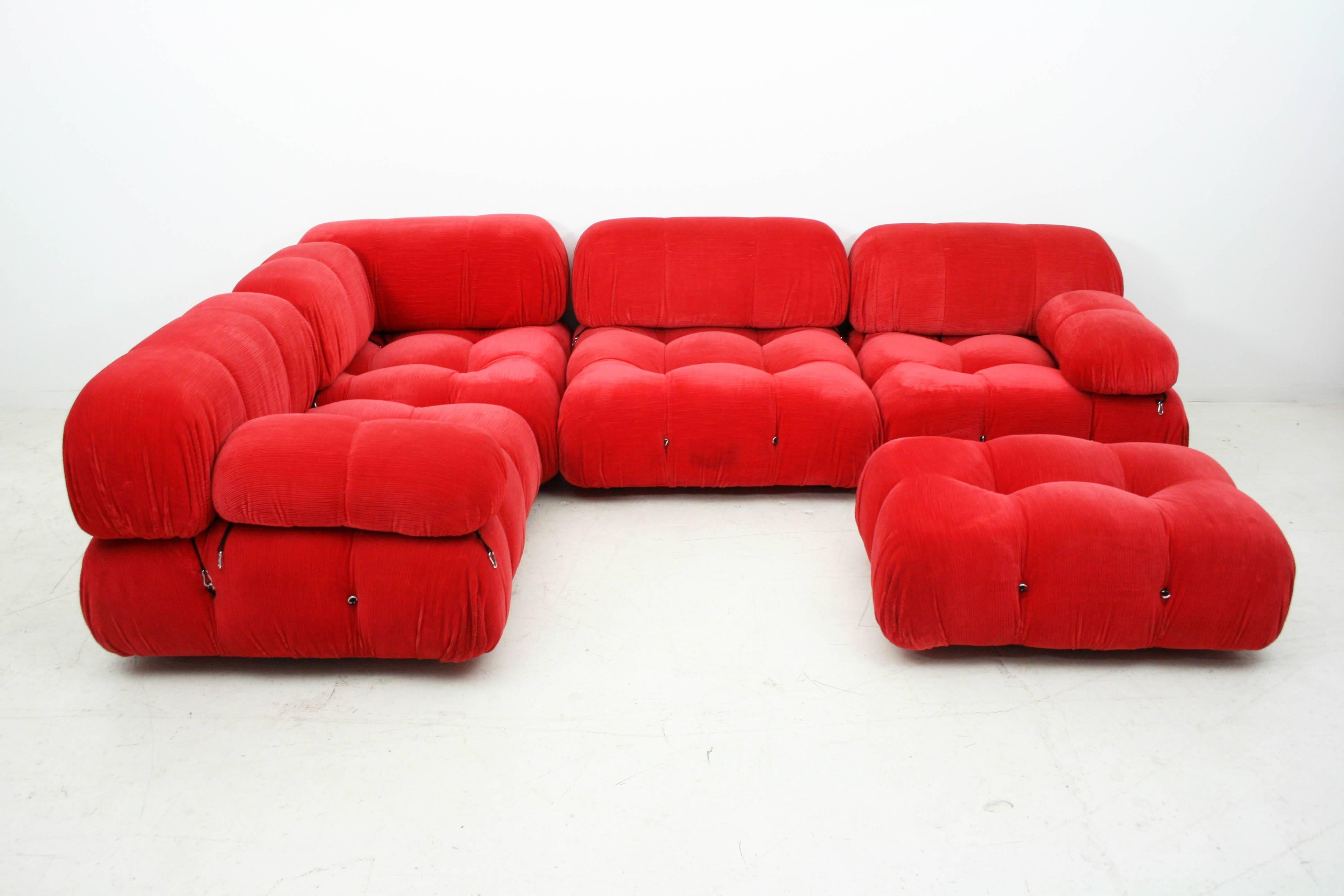A highly modular 'Camaleonda' sofa in original red upholstery designed by renowned architect Mario Bellini. All the elements can be used freely and apart from one another with rings and carabiners to create a perfect 'seating landscape.

Amazing