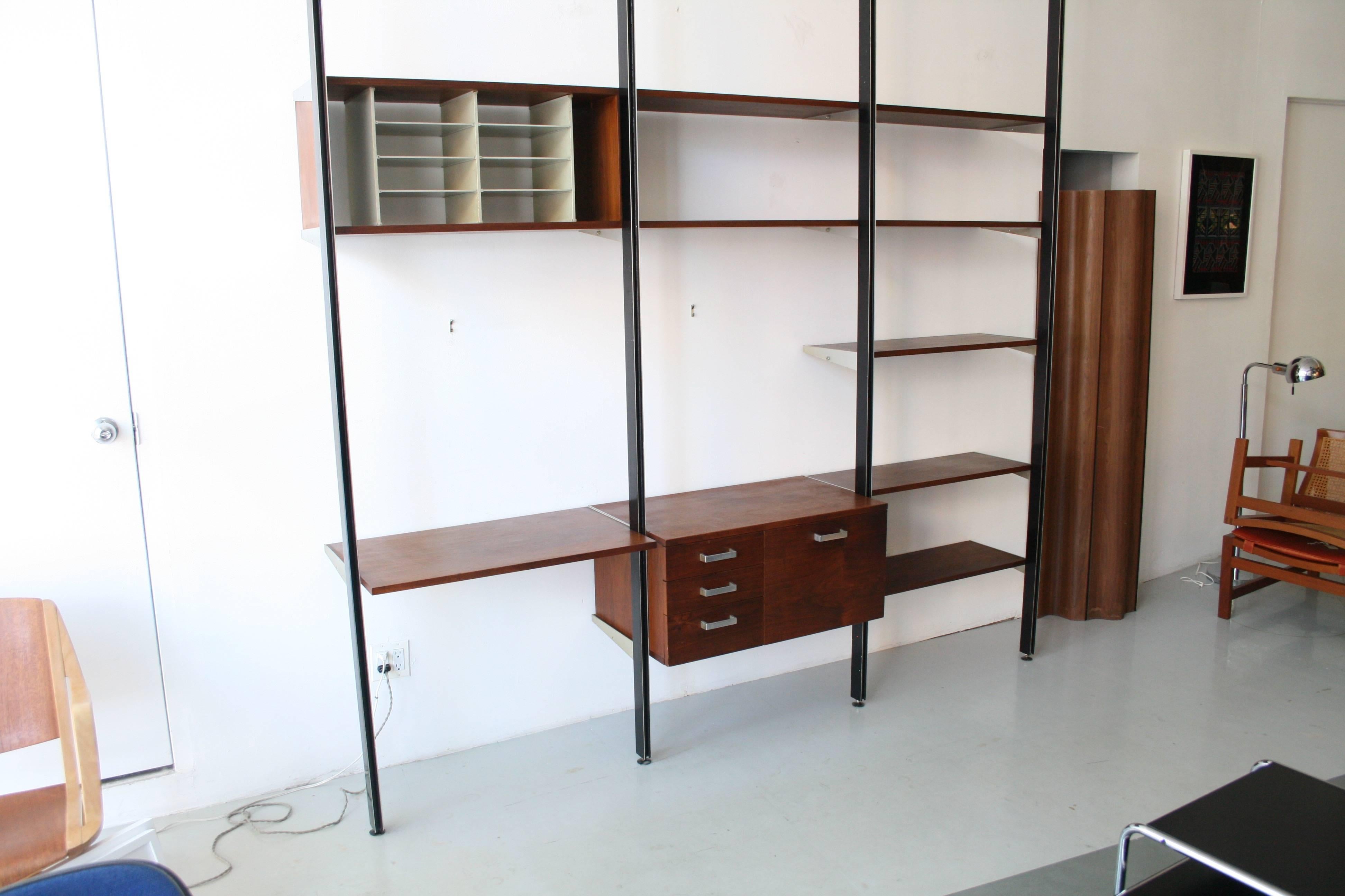 A vintage and all original comprehensive storage system (CSS) by George Nelson for Herman Miller.

This unit consists of:

(4) 105.5