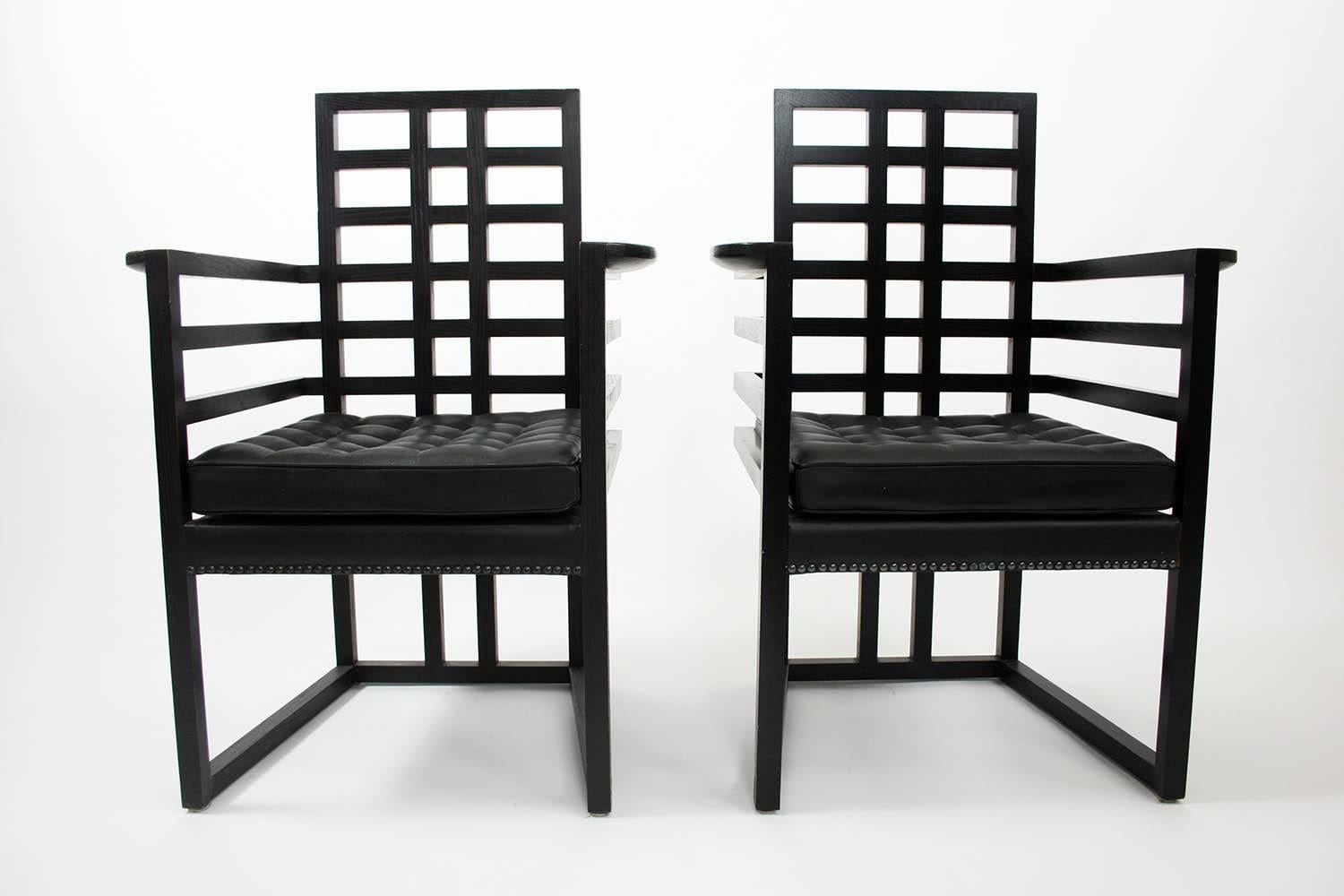Pair of Josef Hoffmann Armloffel chairs made by Wittmann with leather seat cushions in excellent condition.

Dimensions: 38