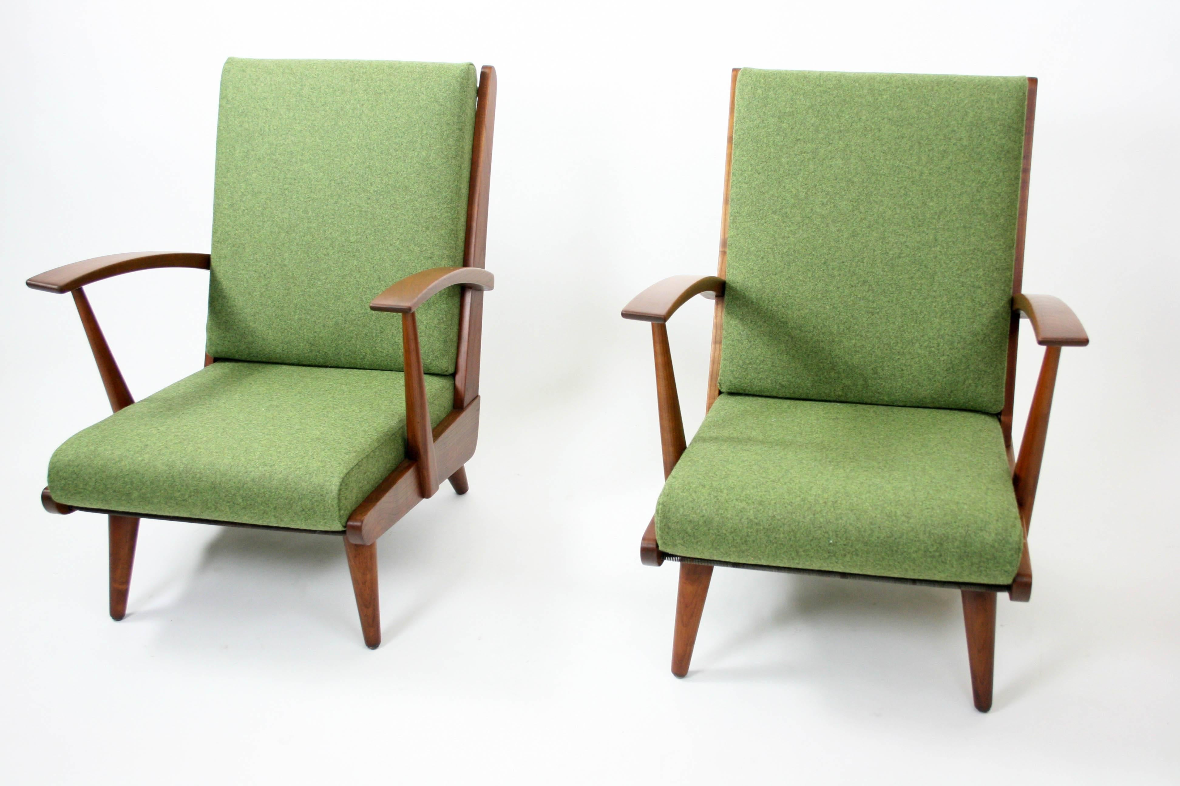 A wonderful and comfortable pair of early lounge chairs, most likely Danish or Swedish. Pair is unmarked and designer unknown. The hardwood frames have been delicately restored and the upholstery is new. (green maharam-wool-melange). This pair is a