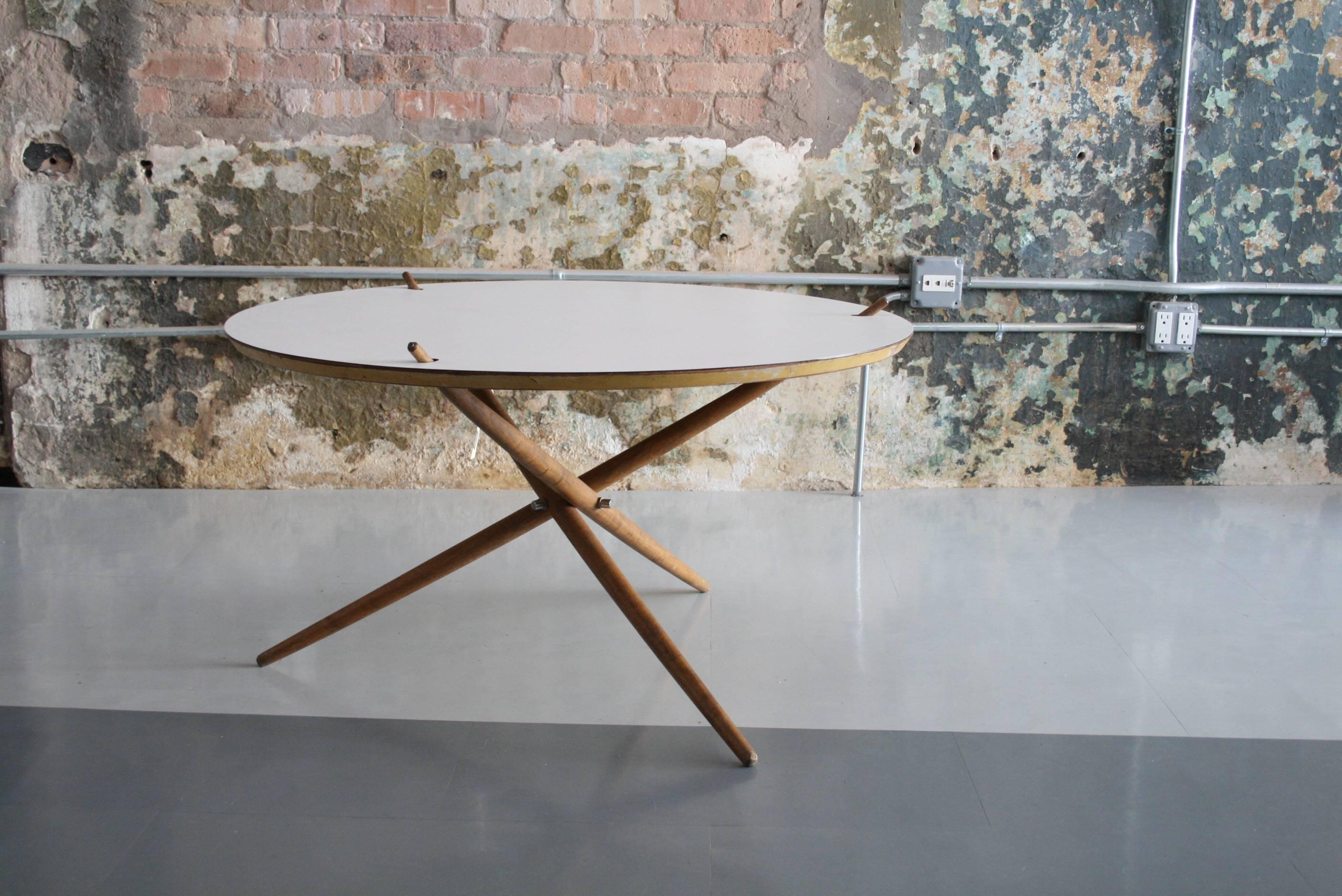 Rare early Knoll tripod coffee table designed by Hans Bellman in 1948. This is the only example of this form that we have ever seen on the market.

Dimensions: 36