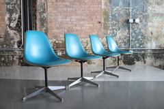 Four Herman Miller Upholstered Pedestal Chairs by Charles and Ray Eames