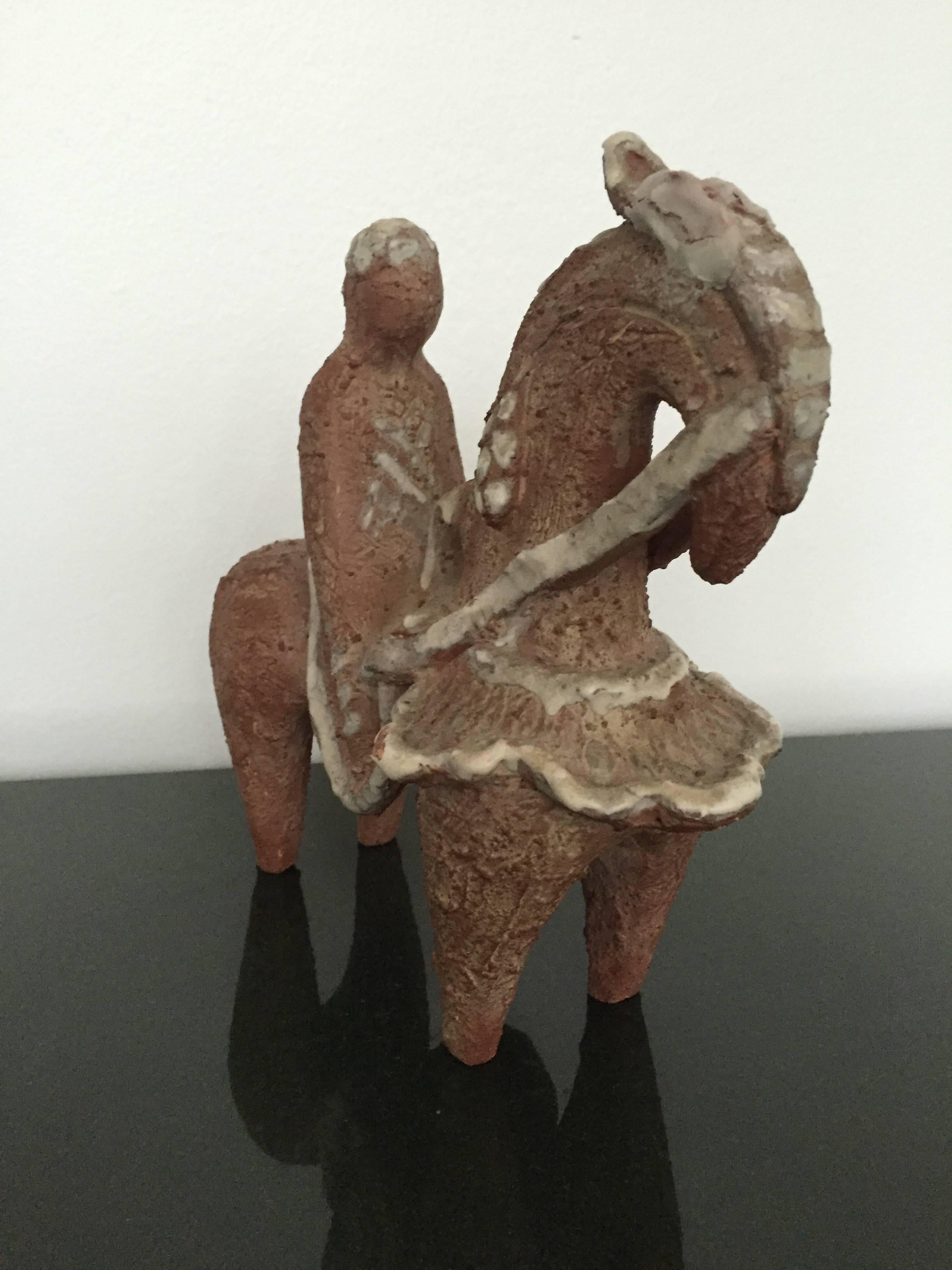 Unique Mid-Century Modern Italian signed and numbered 1950s horse and rider ceramic sculpture. Great condition and very attractive. The ceramic measures: 9.5" wide x 9" high x 4.5" deep.