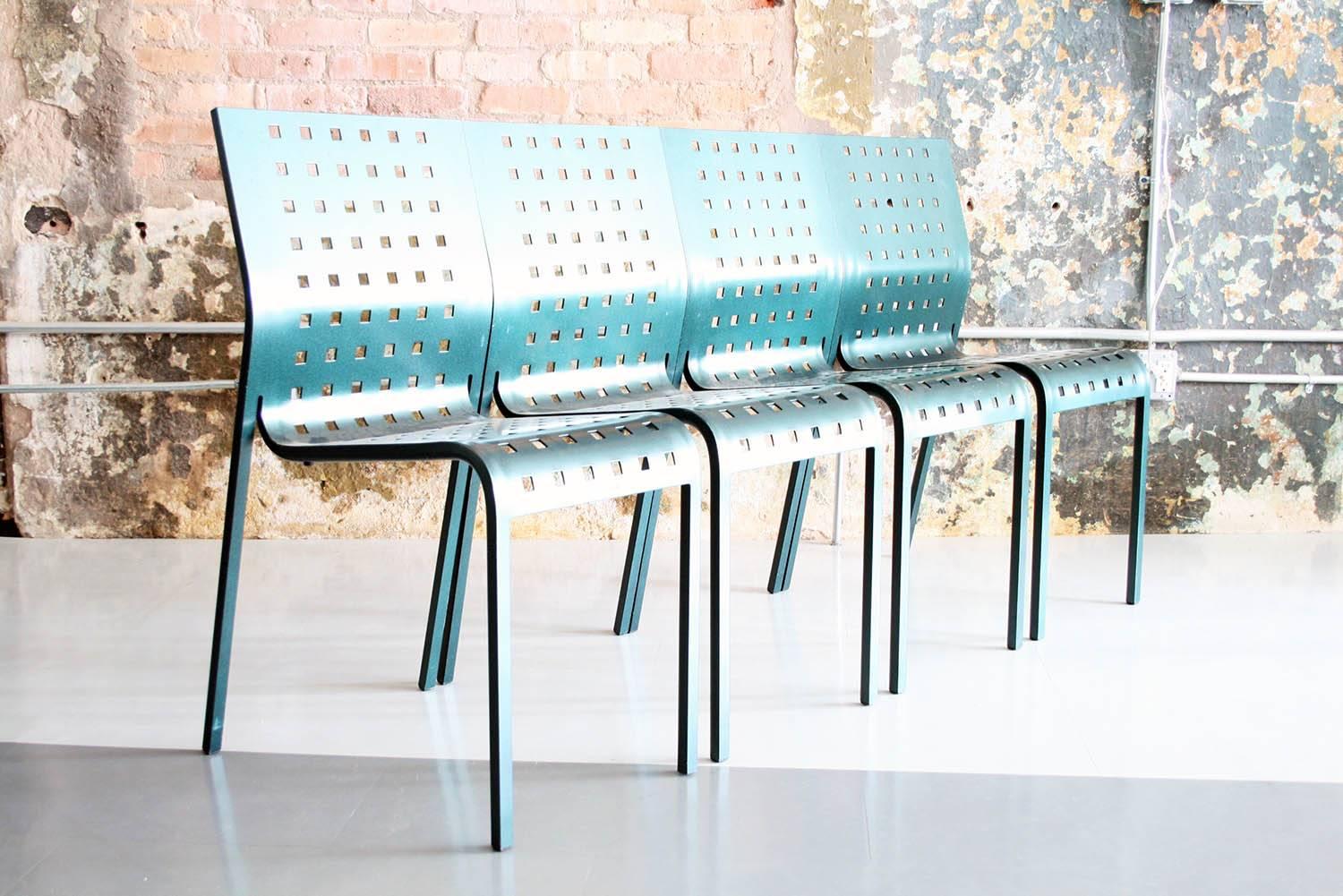 Four green metal stacking dining chairs by Pietro Arosio for Zanotta Italy in excellent condition.

Stackable metal-green chair in enamelled aluminium alloy for outdoor use. 
Now out of production.