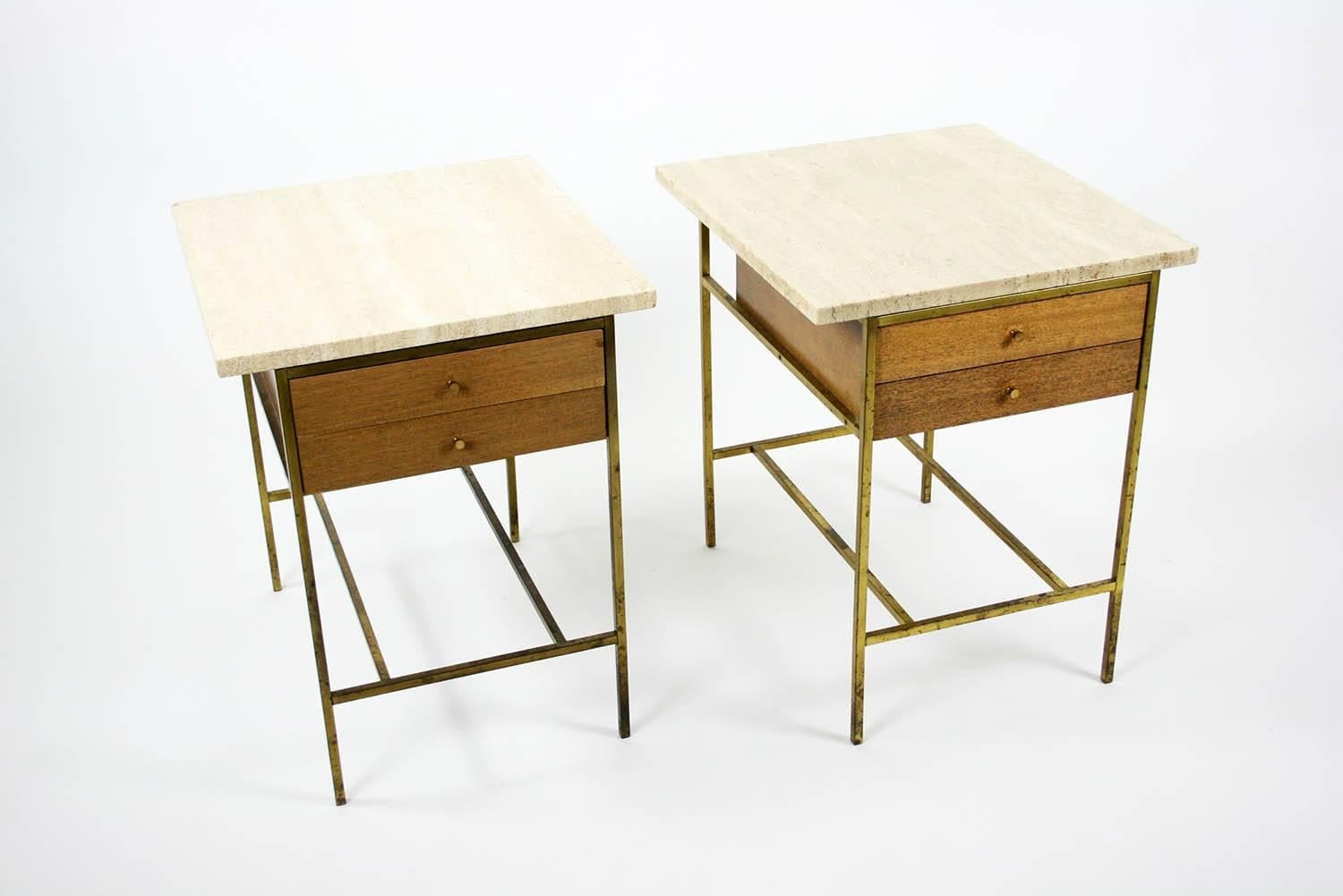 A pair of two-drawer nightstands with travertine tops and flat brass button pulls, Mod. No. 8712, by Paul McCobb for Calvin Group. American, circa 1950.