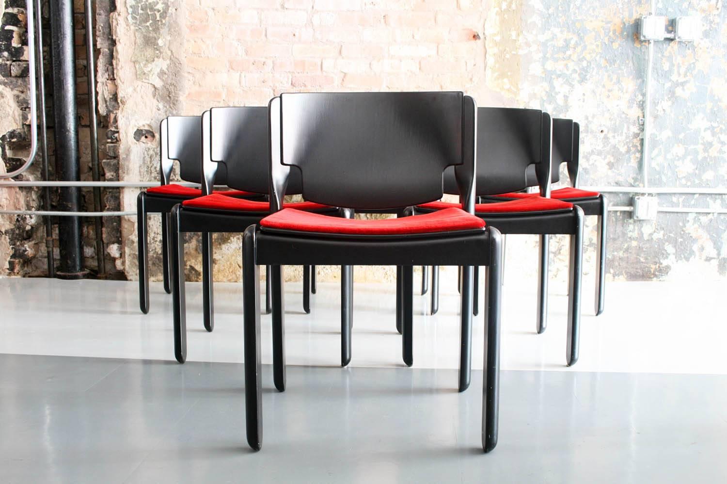 Set of six 1967 Vico Magistretti model 122 chairs for Cassina, Italy. 
Rare chairs having original velvet seats, Italian walnut frames and stackable. 

Magistretti's experiments with stackable chairs started with this small production in walnut