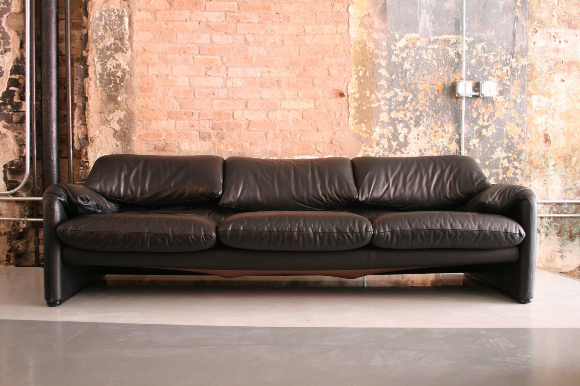 Beautiful vintage black leather sofa. The back rests on this piece expand to heighten the back rest for added comfort.

Marked Cassina / Italy.